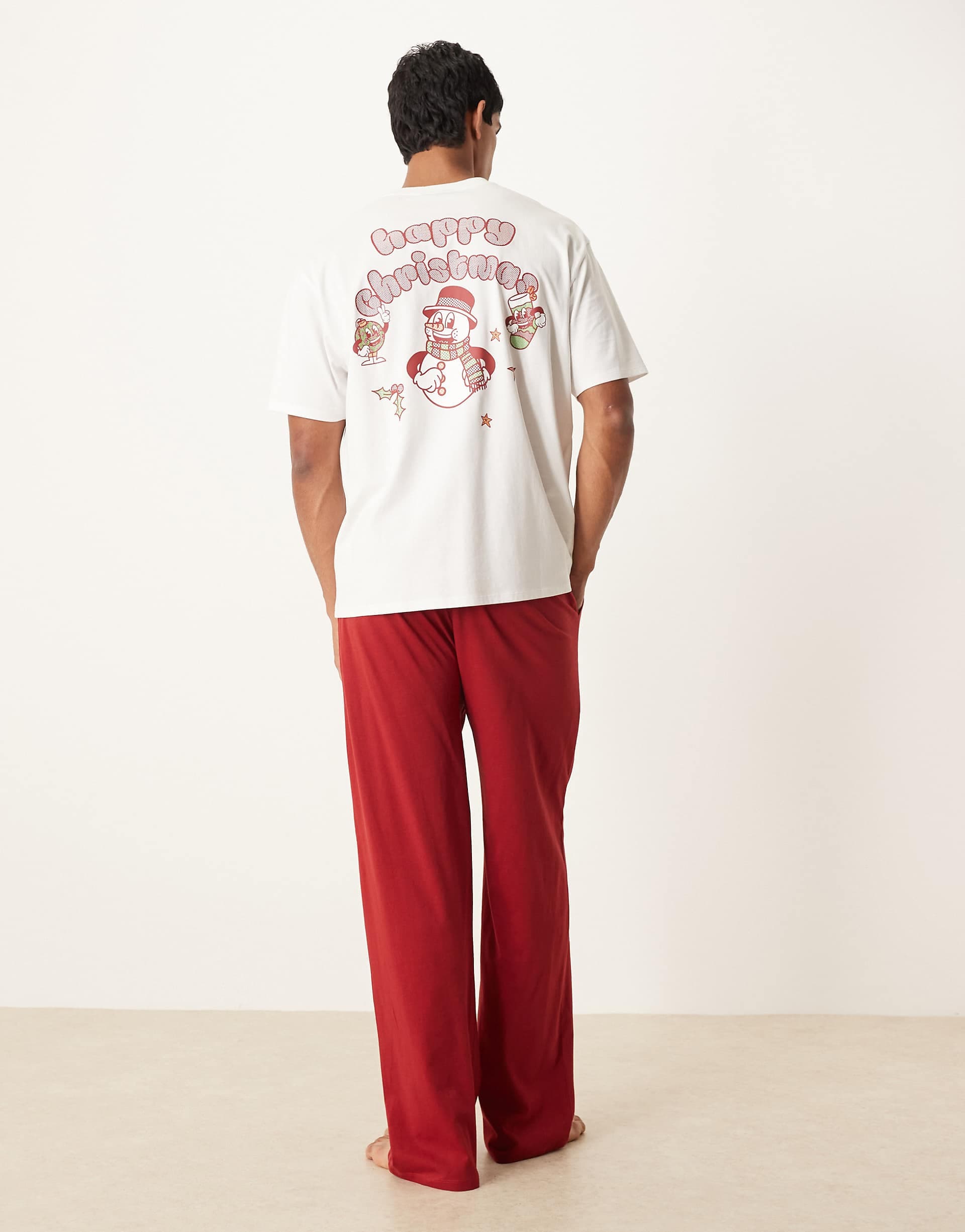ASOS DESIGN Christmas pajama set with characters graphic in red