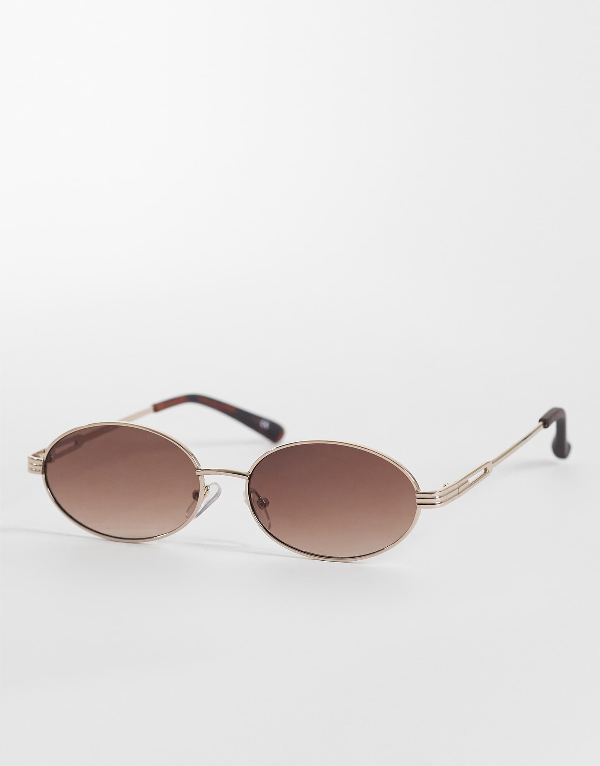 ASOS DESIGN metal oval sunglasses in gold with tort tips