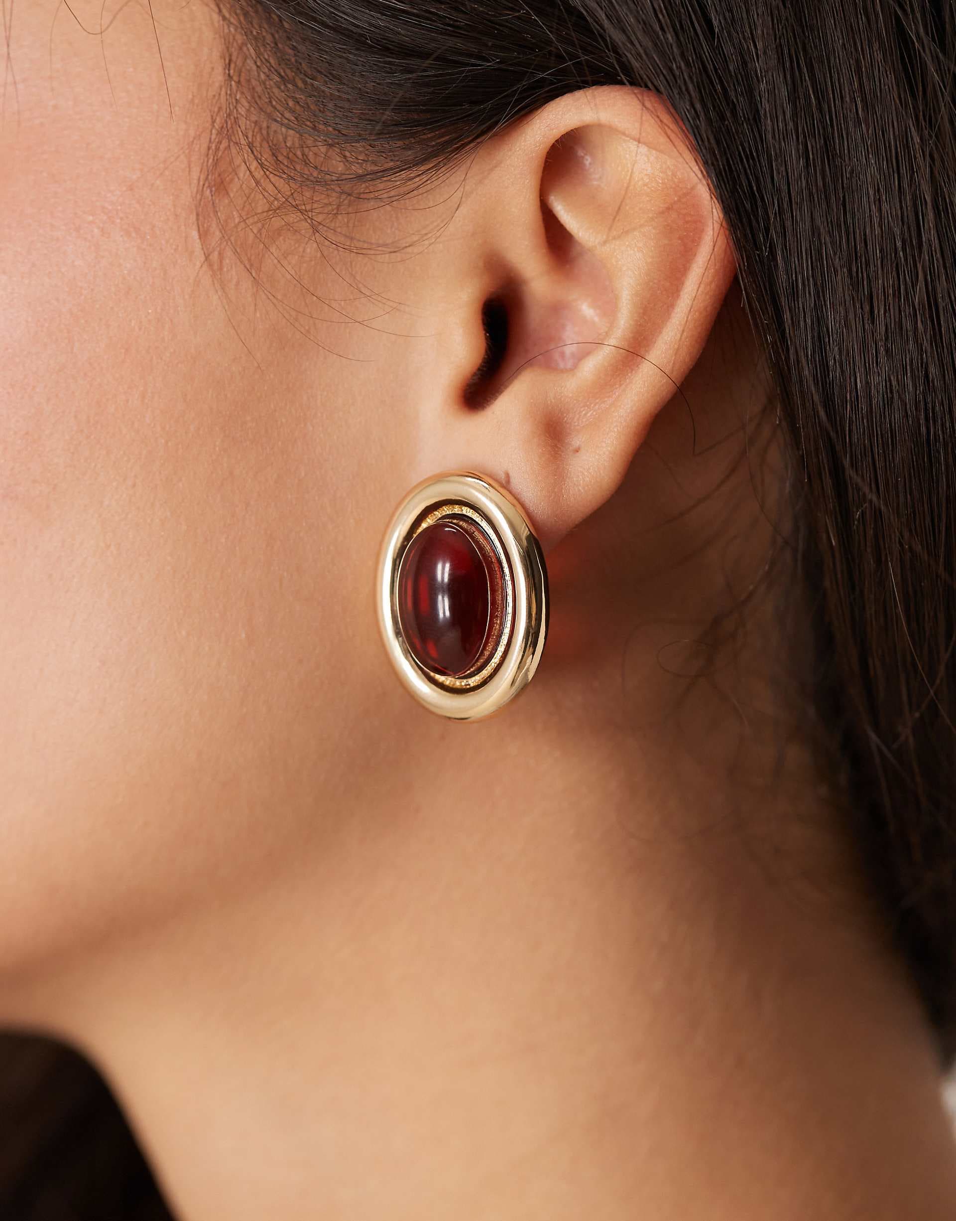 ASOS DESIGN stud earrings with burgundy stone set design in gold tone