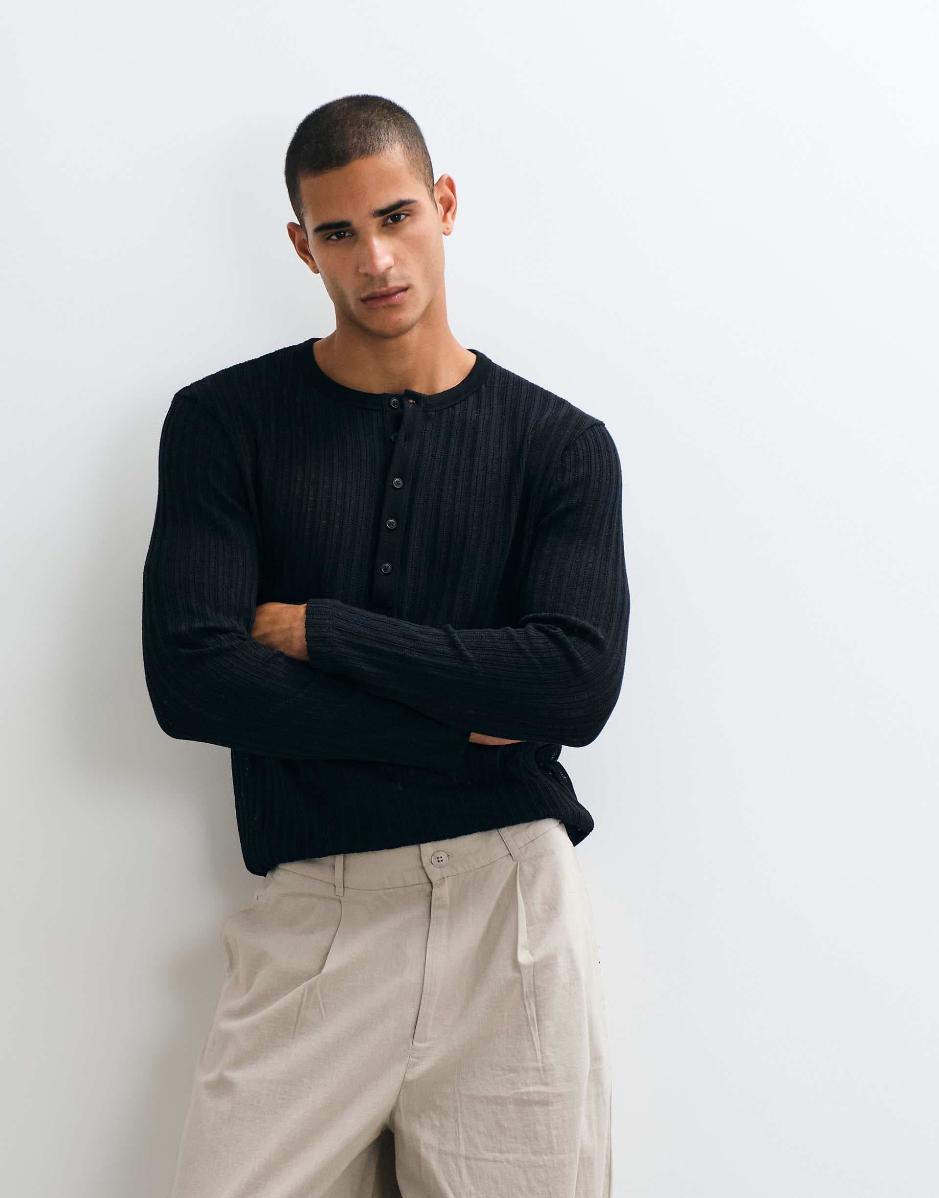 ASOS DESIGN regular long sleeve henley T-shirt in black textured fabric