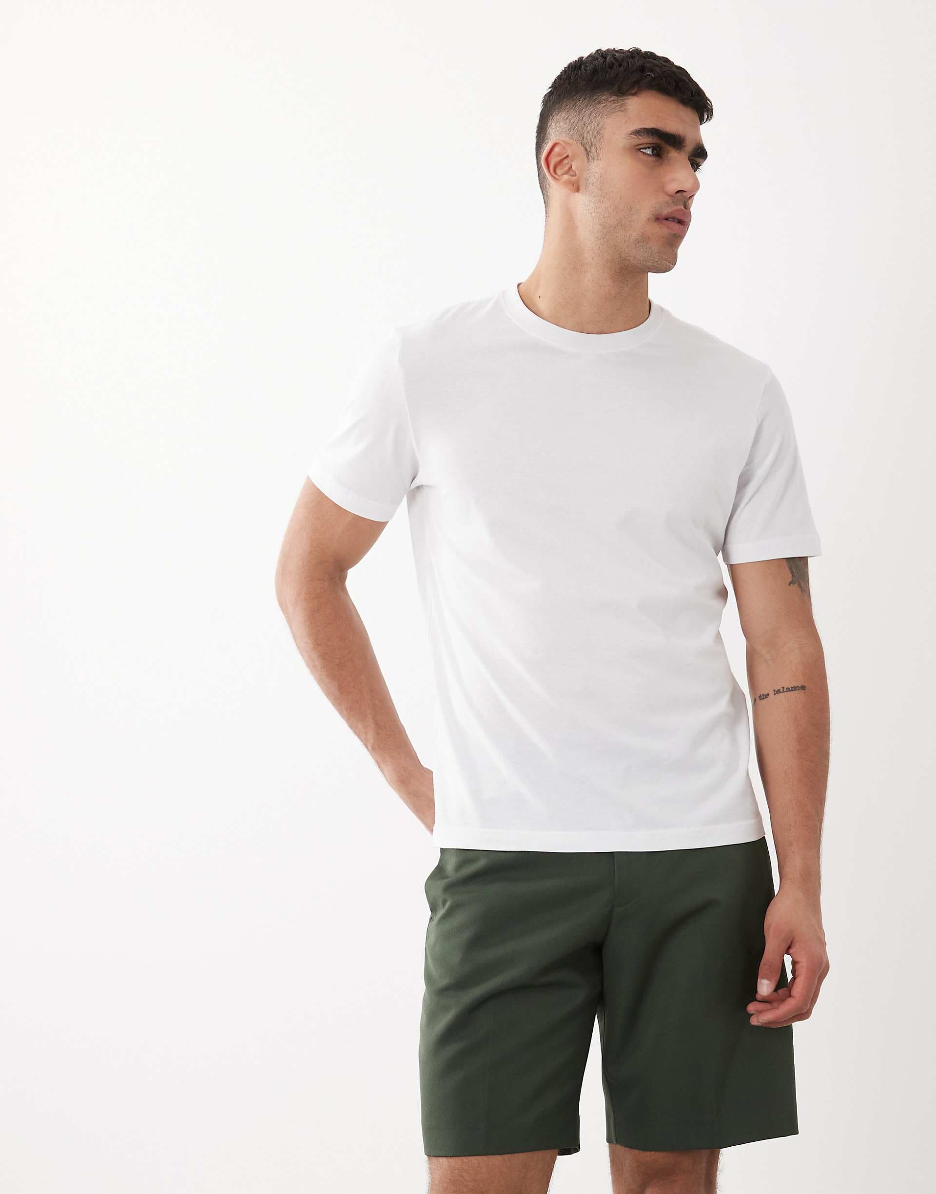 ASOS DESIGN smart regular shorts in dark green with turnup