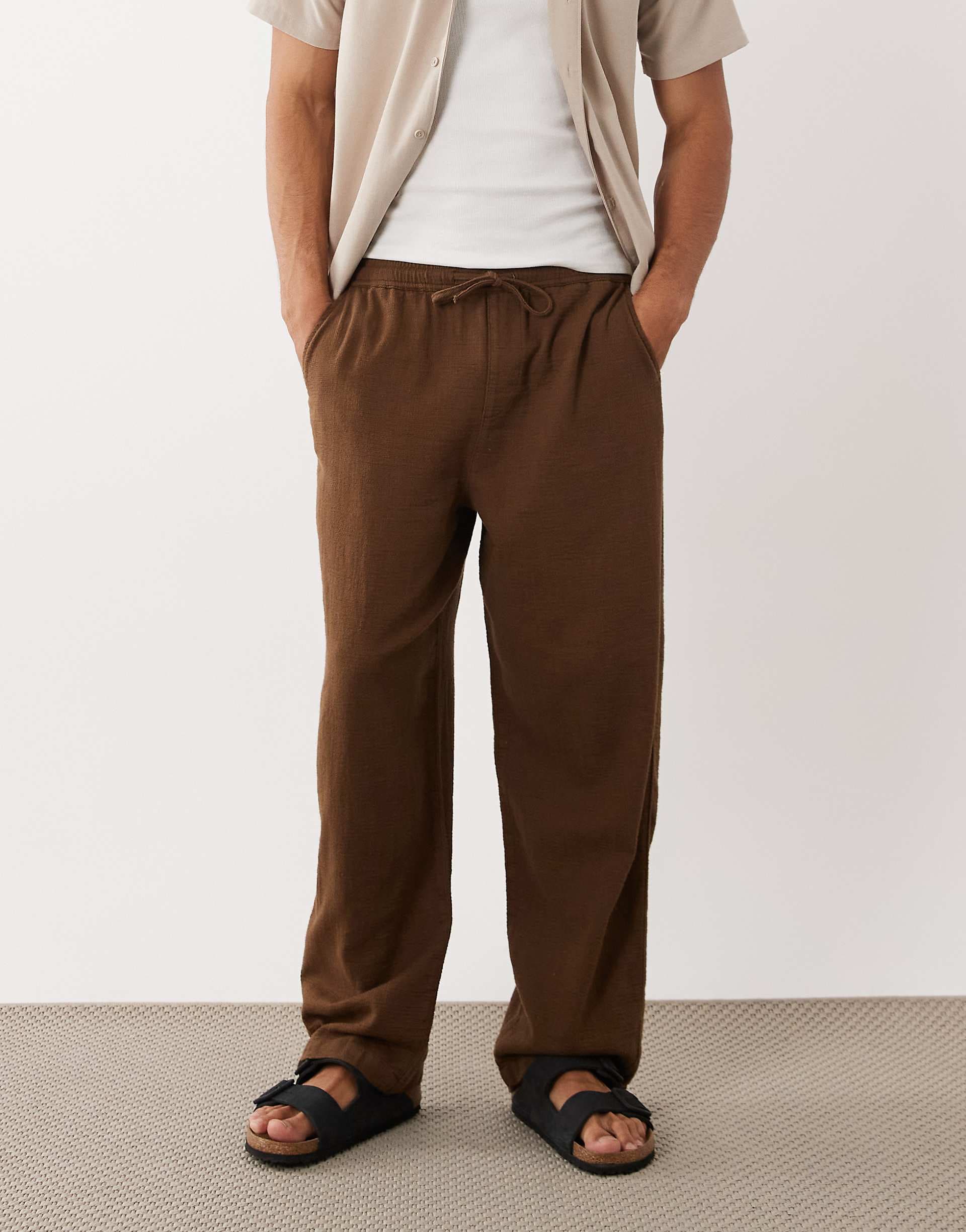 ASOS DESIGN loose textured trousers in brown with elastic waistband