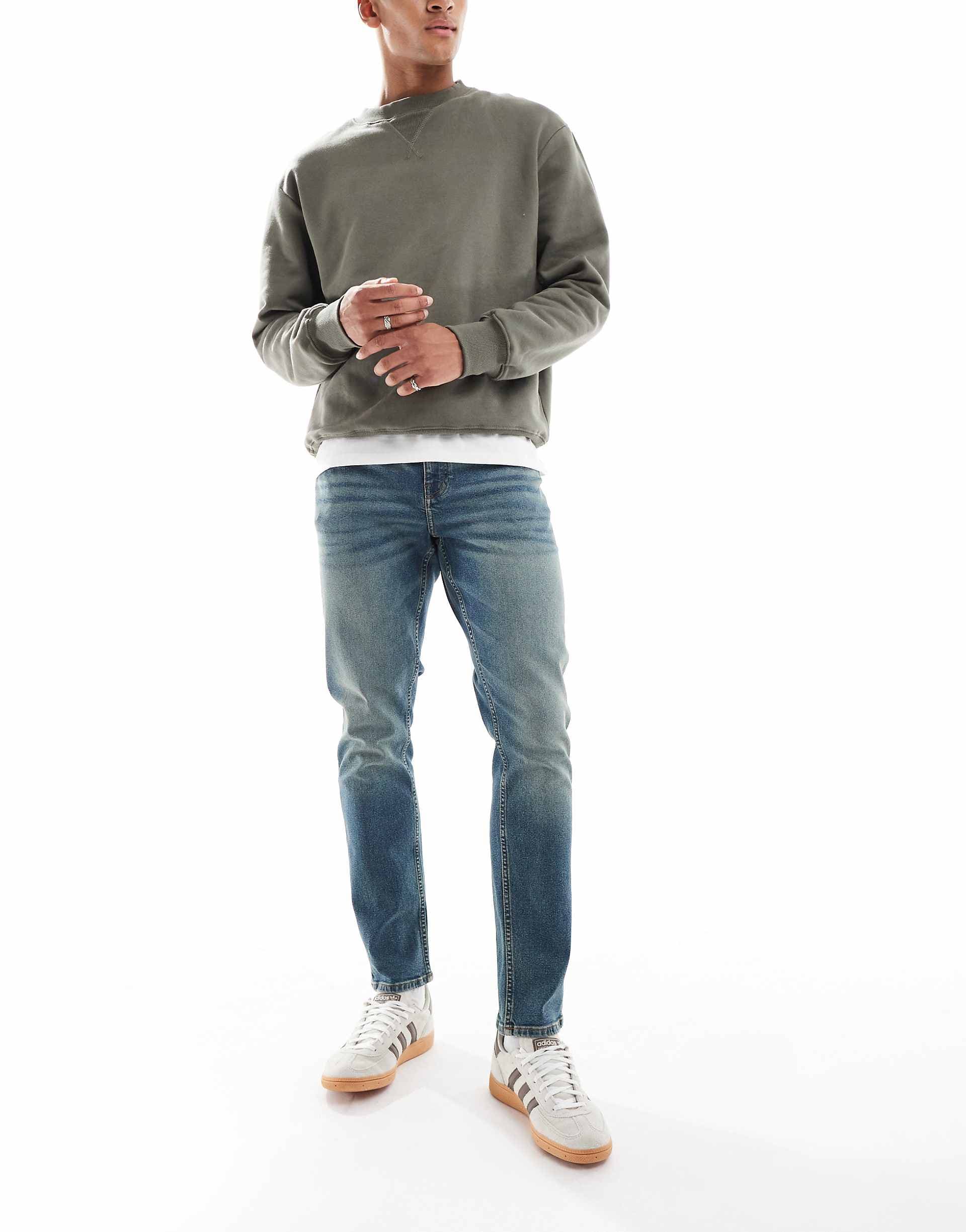 ASOS DESIGN slim jeans in mid wash blue with tint