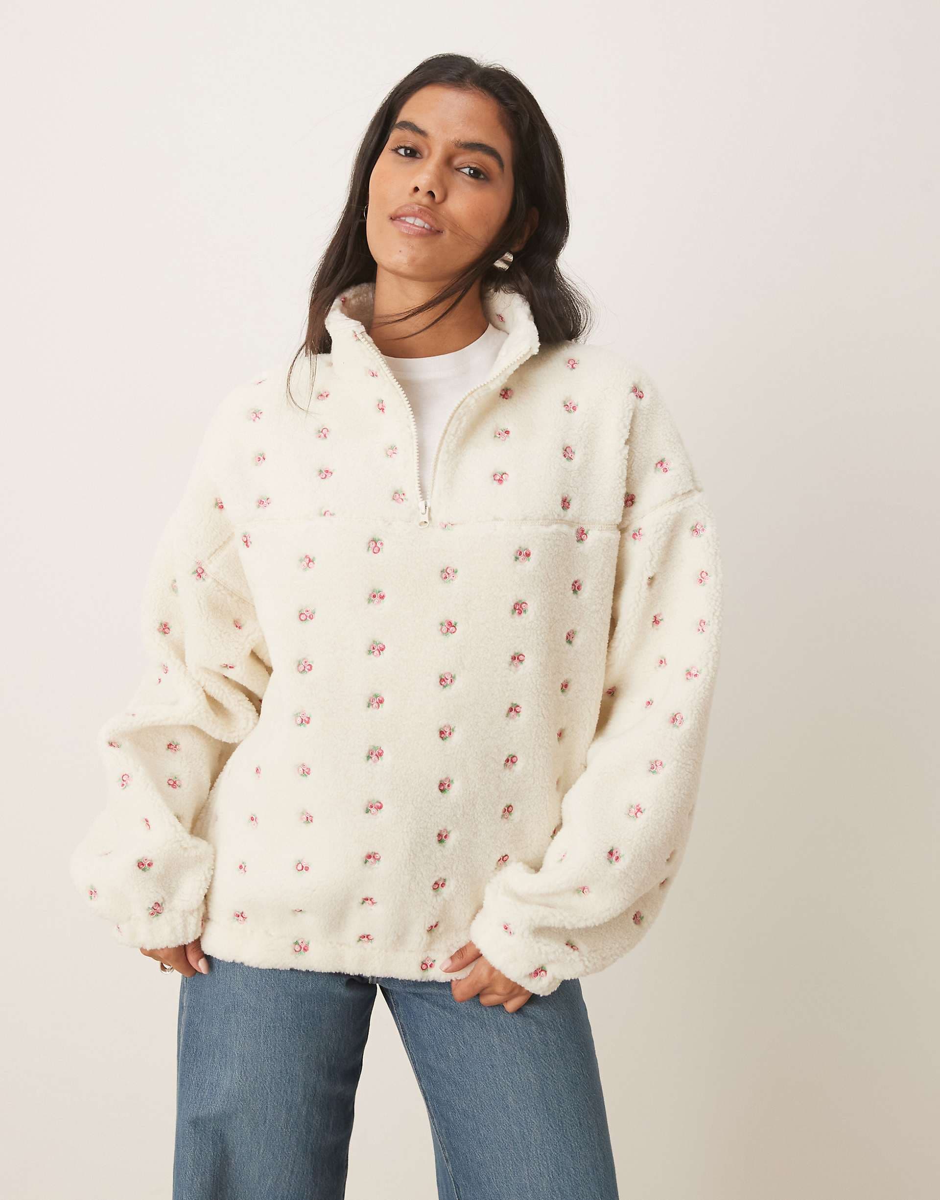 ASOS DESIGN borg zip through fleece with embroidered flower detail in cream