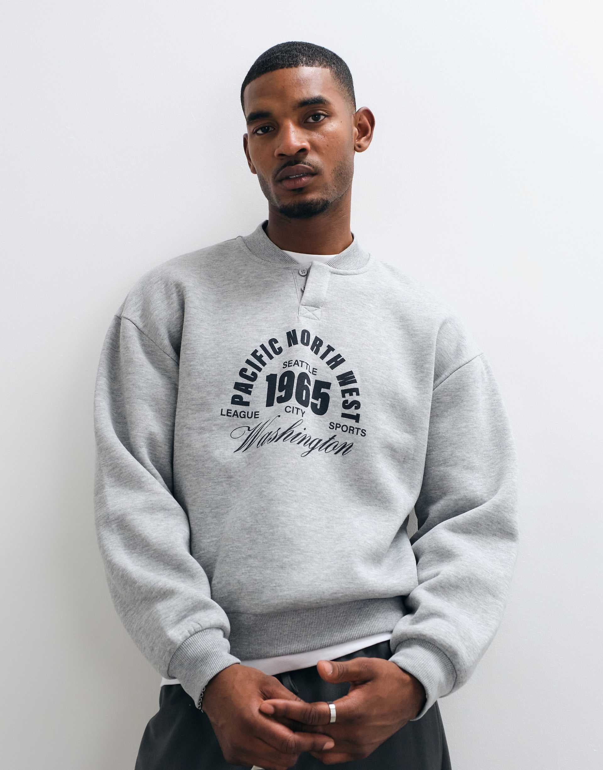 ASOS DESIGN oversized concealed henley crew neck sweatshirt with front pigment print