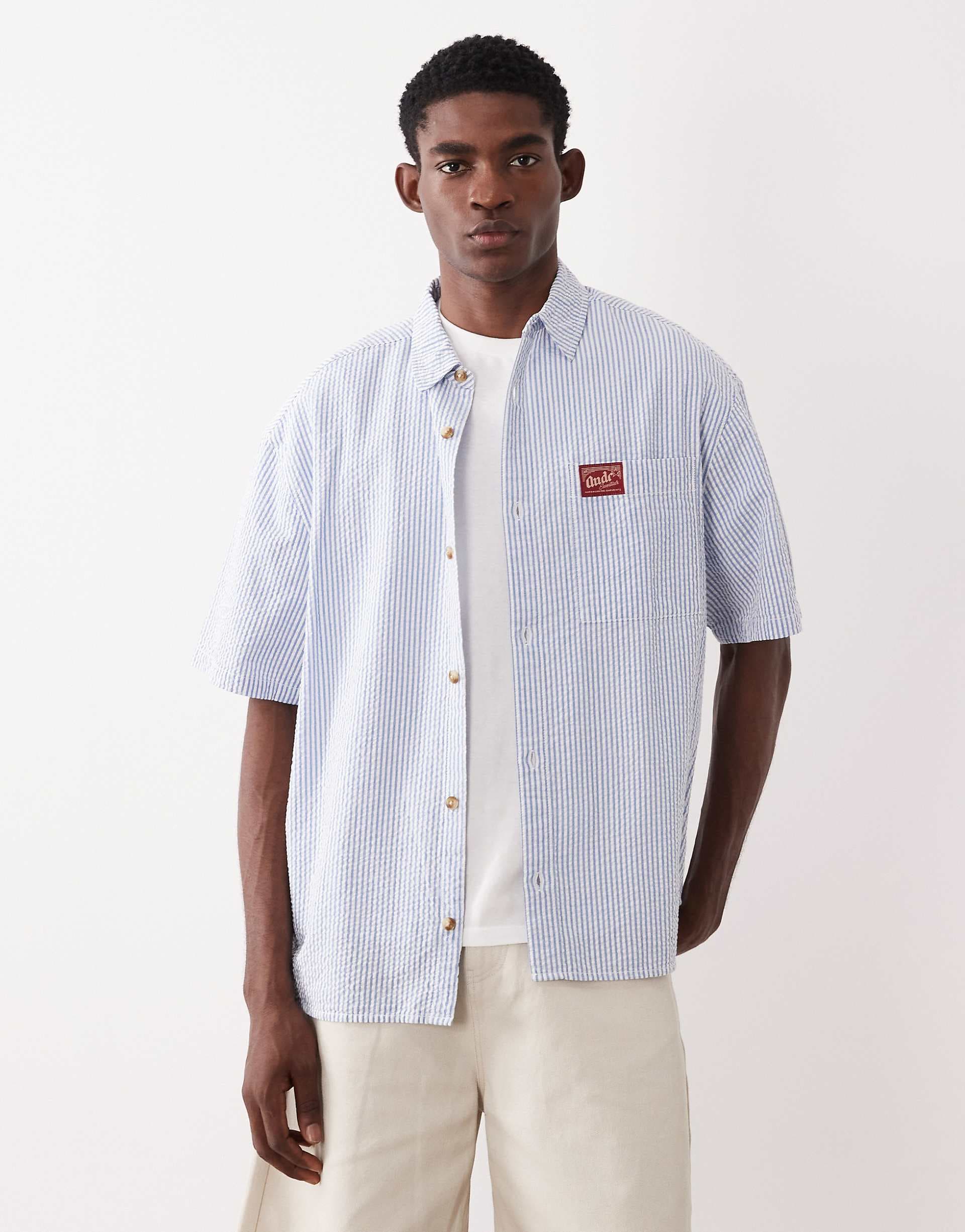 ASOS DESIGN oversized striped shirt with badge in blue