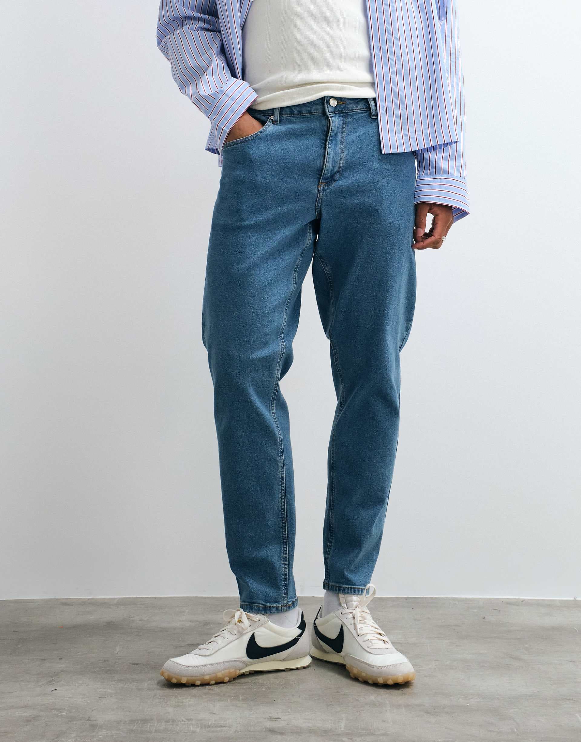 ASOS DESIGN tapered jeans in mid wash blue