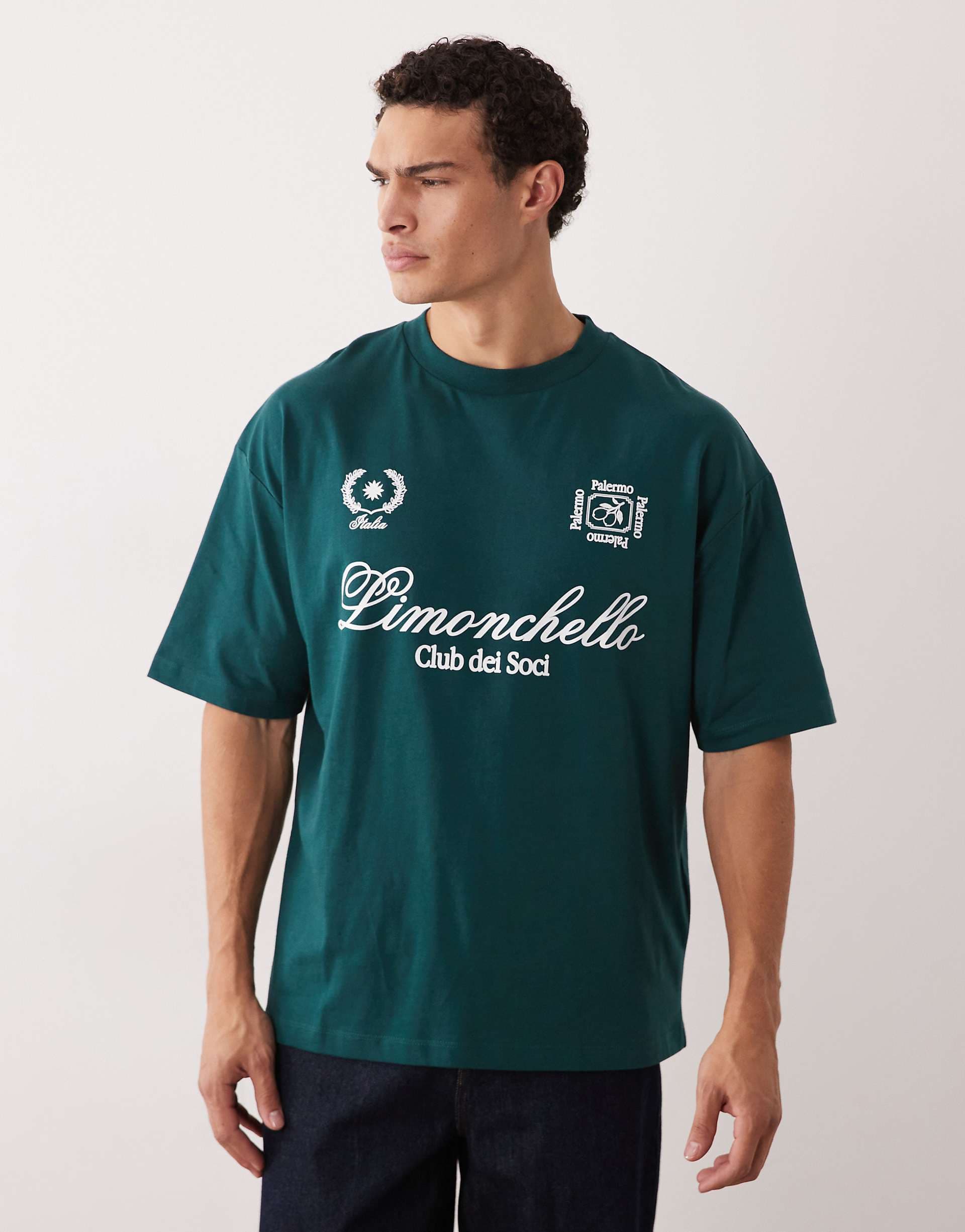 ASOS DESIGN oversized t-shirt with limonchello soccer graphic in dark green