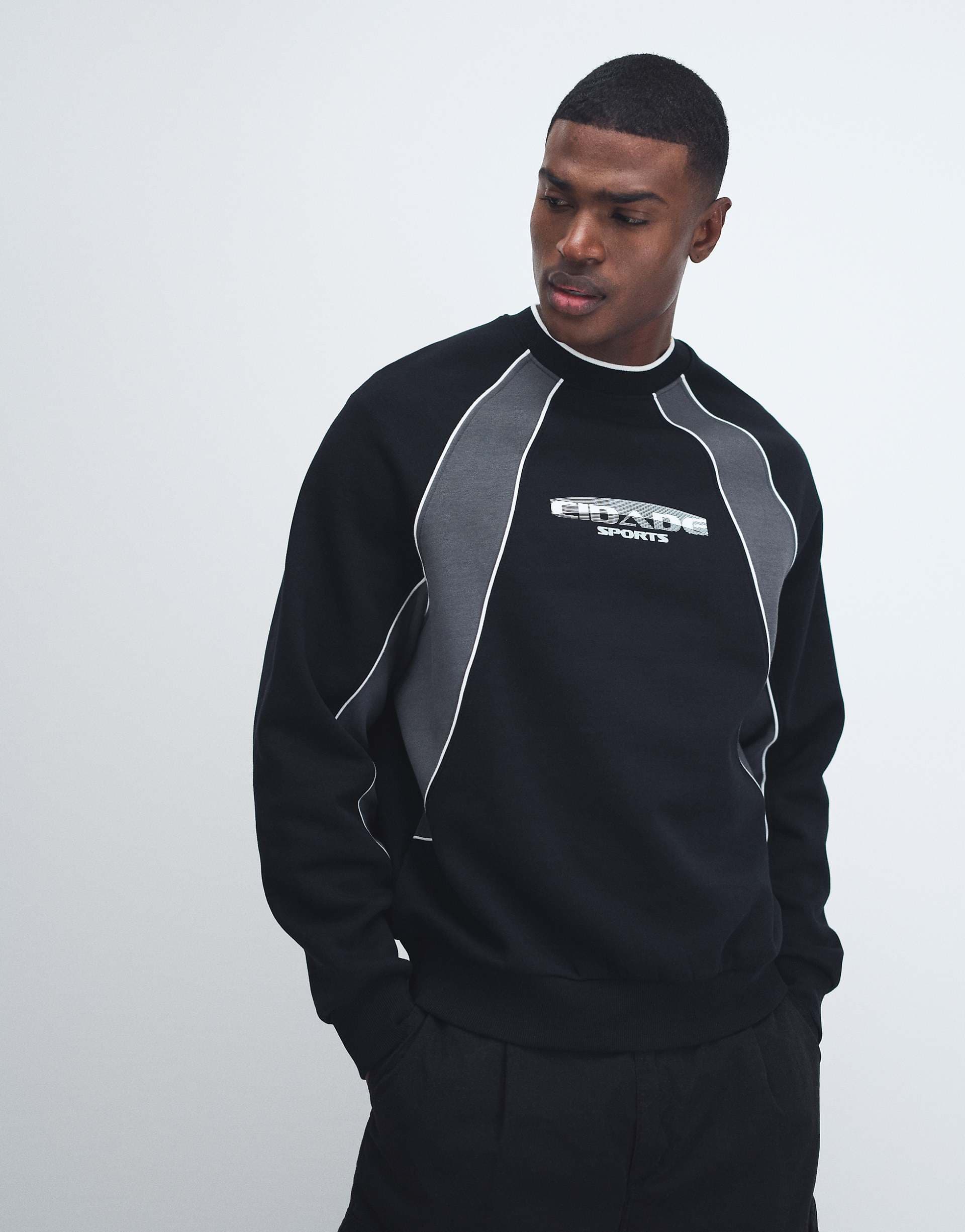 ASOS DESIGN relaxed printed sweatshirt with cut & sew panels in black