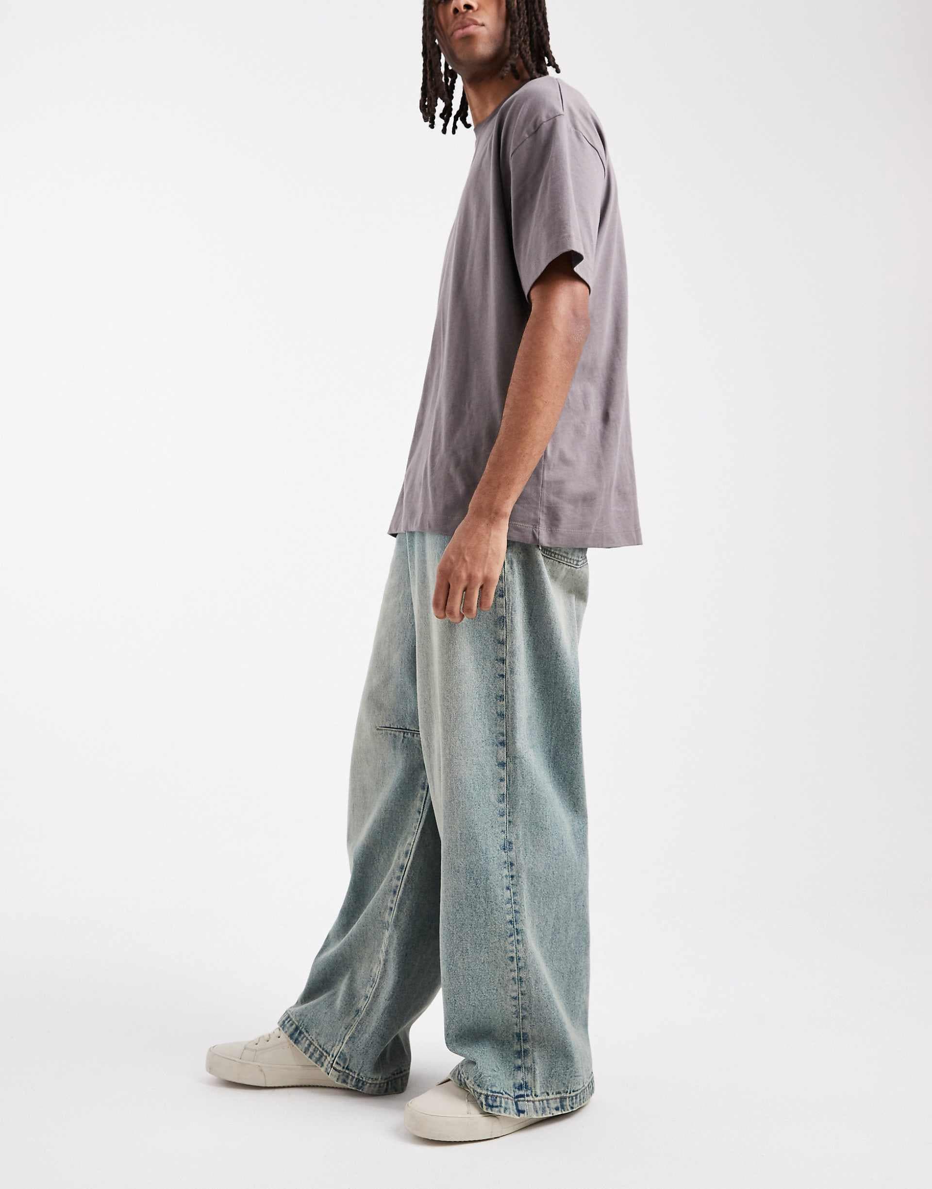 ASOS DESIGN extreme baggy jeans with darts in mid wash blue with tint
