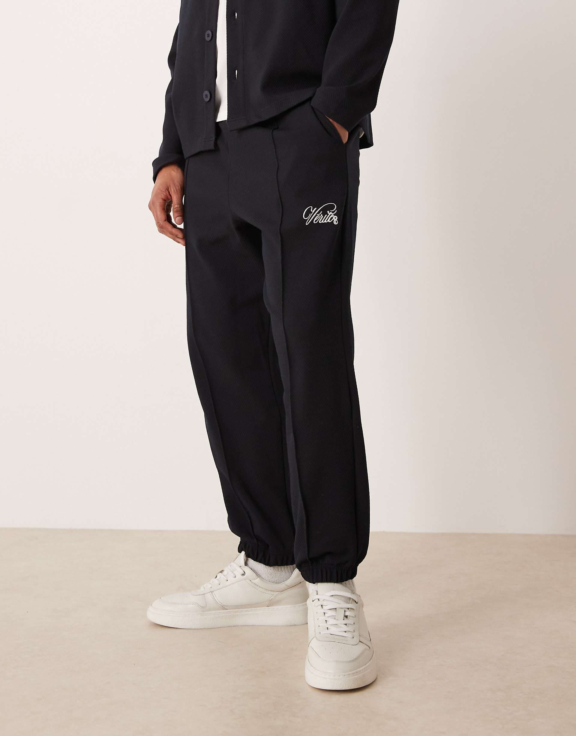 ASOS DESIGN tapered jacquard sweatpants with embroidery in navy - part of a set