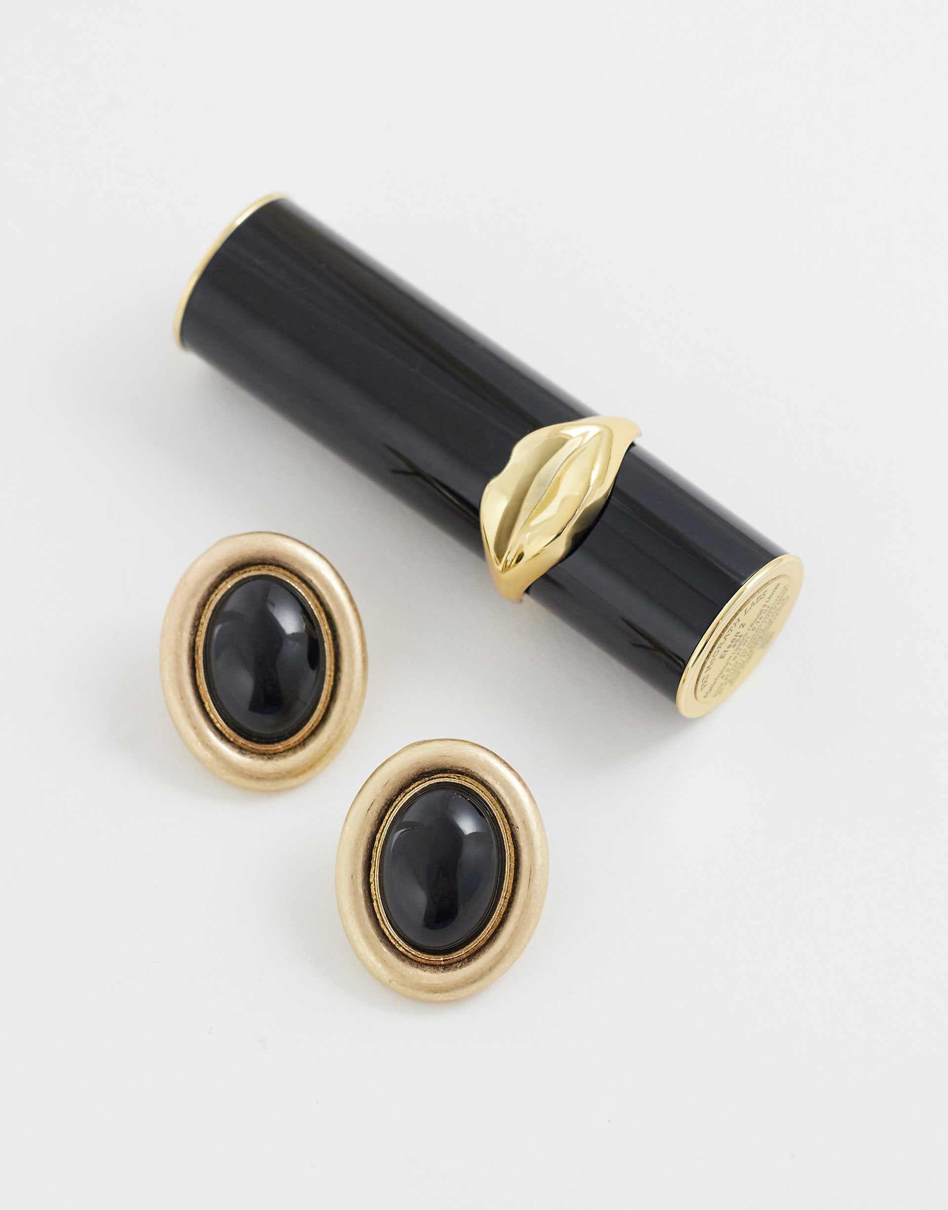 ASOS DESIGN stud earrings with black resin stone set in brushed gold tone