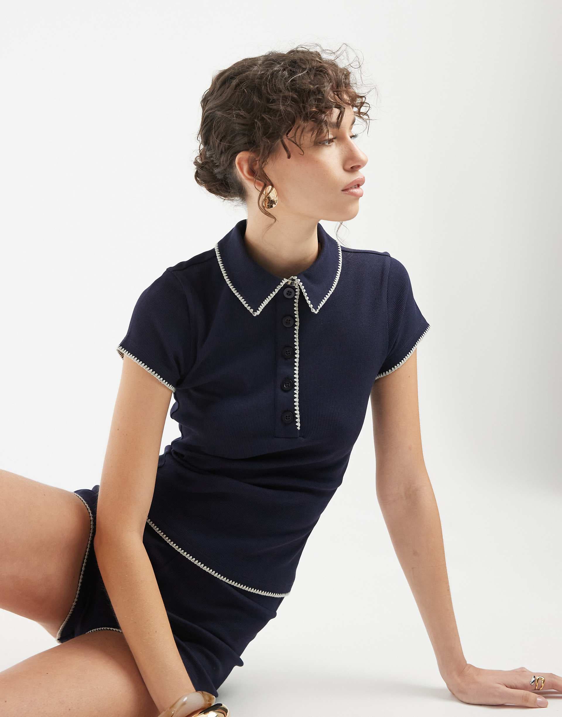 ASOS DESIGN shrunken polo with blanket stitch detail in navy