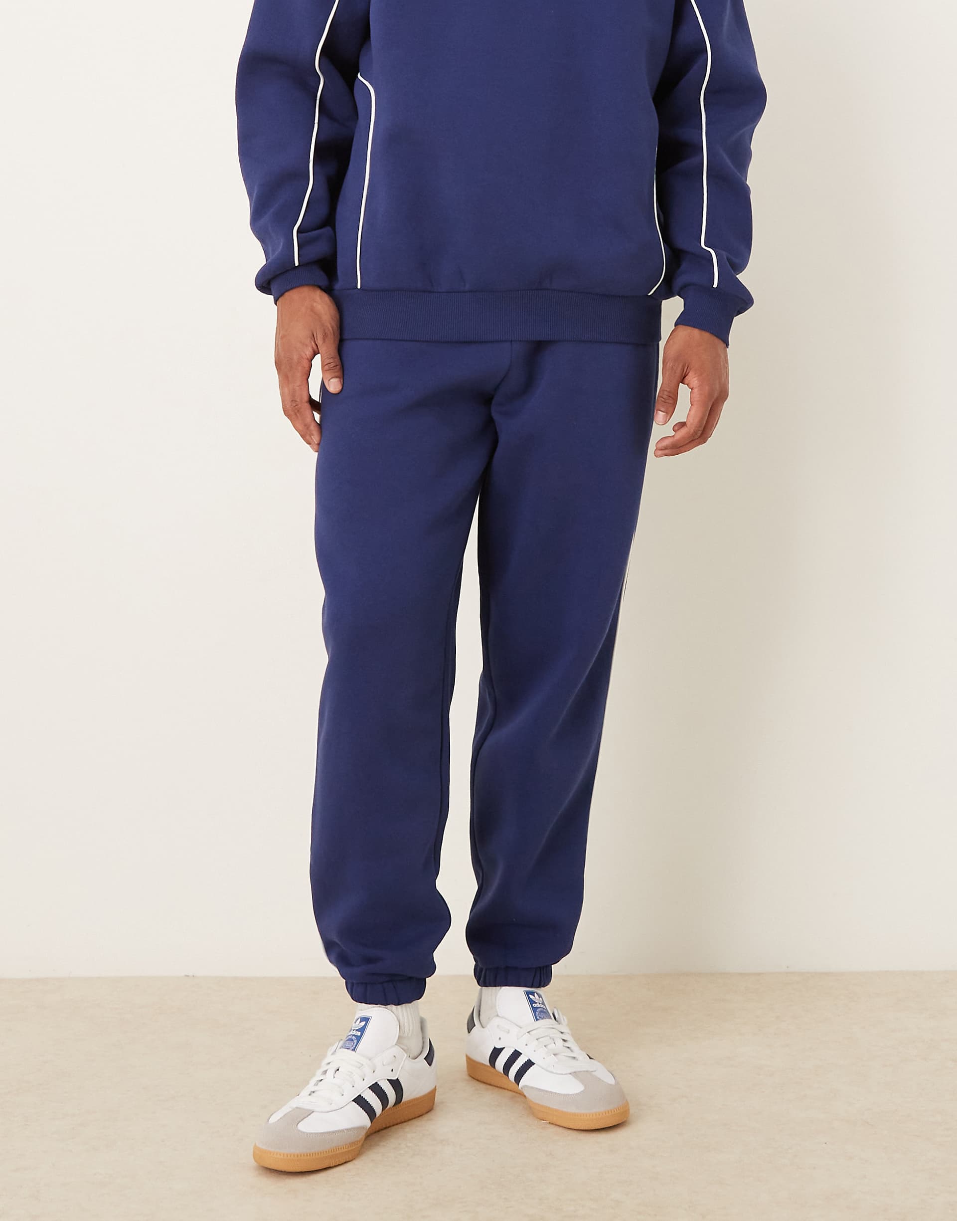 ASOS DESIGN oversized sweatpants with piping in blue