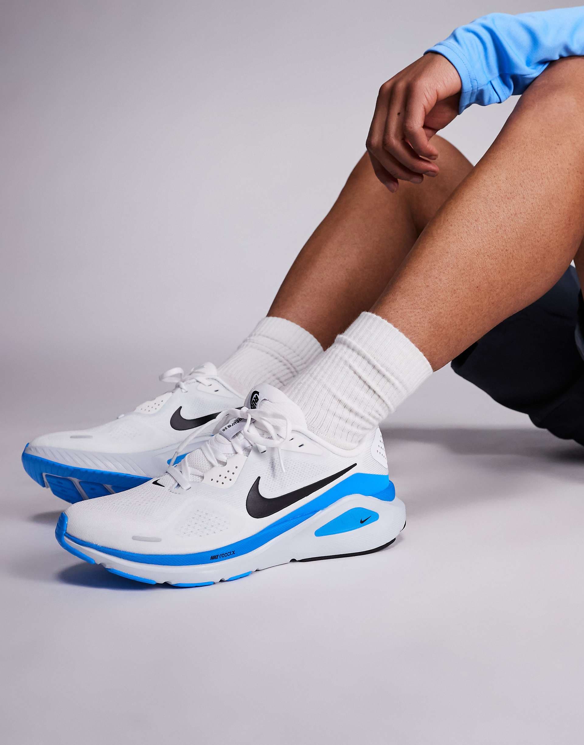 Nike Running Structure 26 sneakers in white and blue
