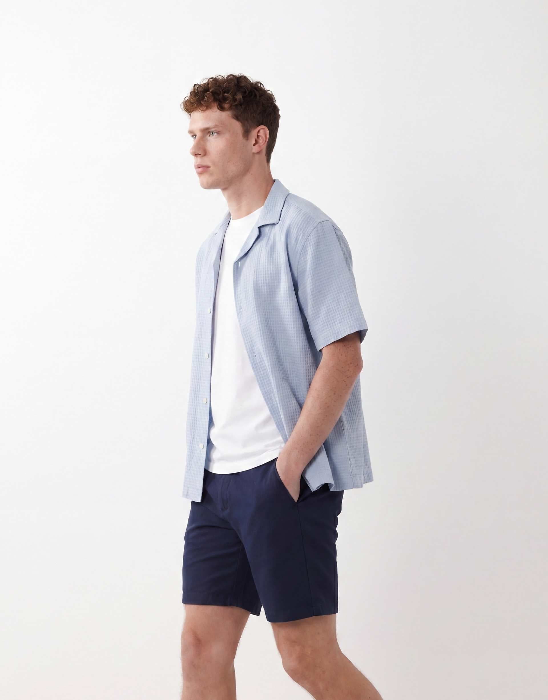 ASOS DESIGN skinny fit chino shorts in mid length in navy