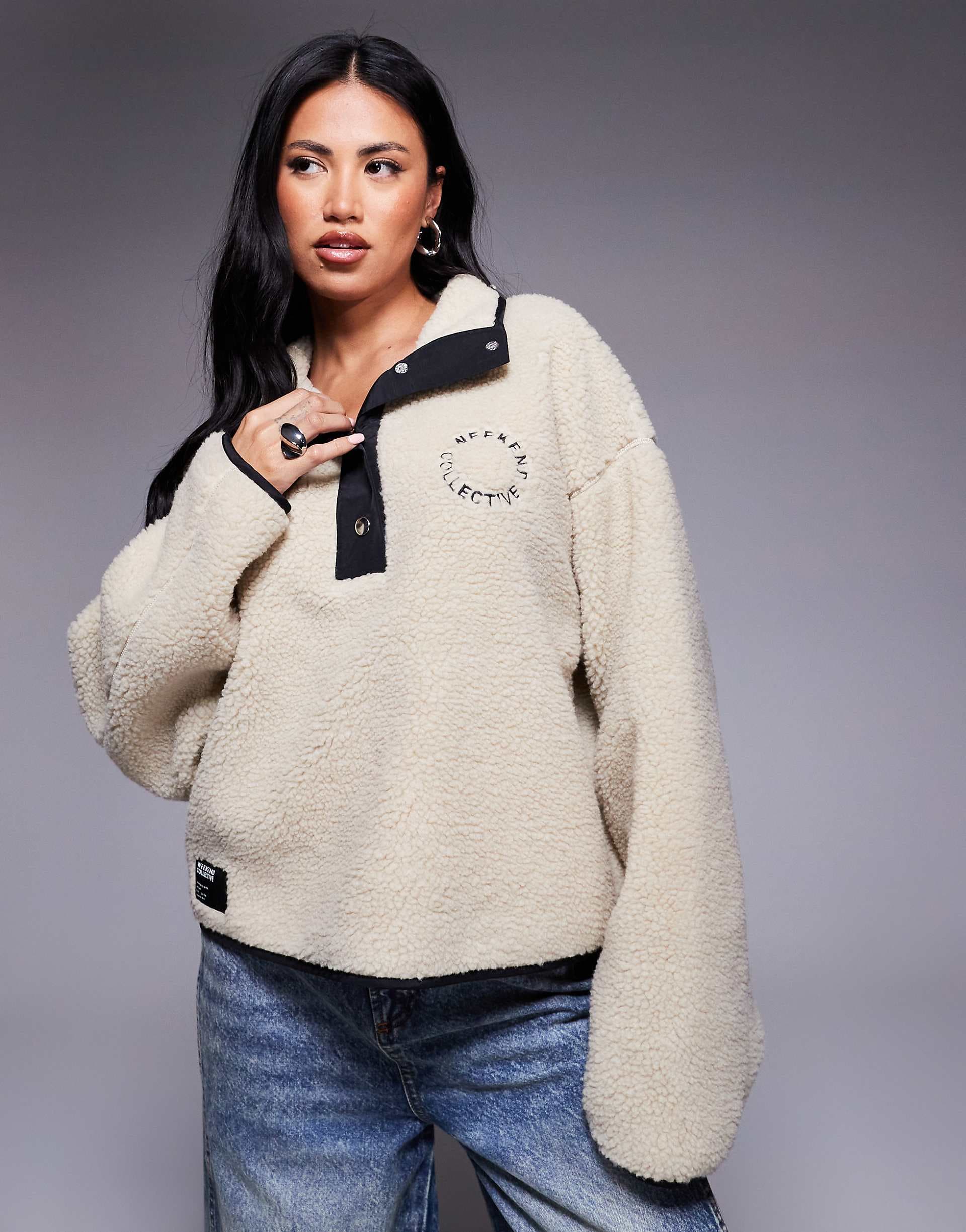 Weekend Collective borg fleece with black nylon trim and snap detail in cream