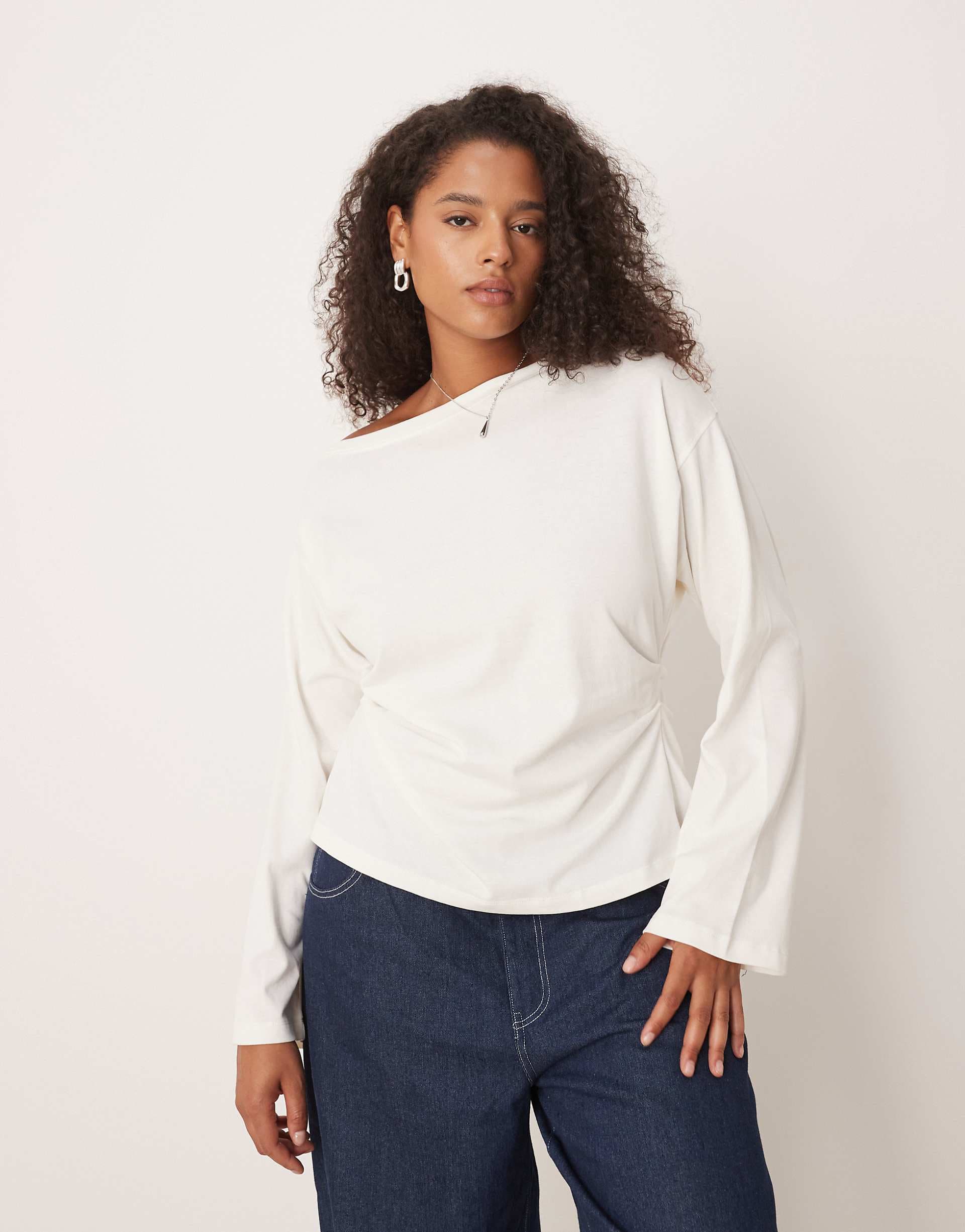 ASOS DESIGN Curve long sleeve off-shoulder corset waist tee in cream