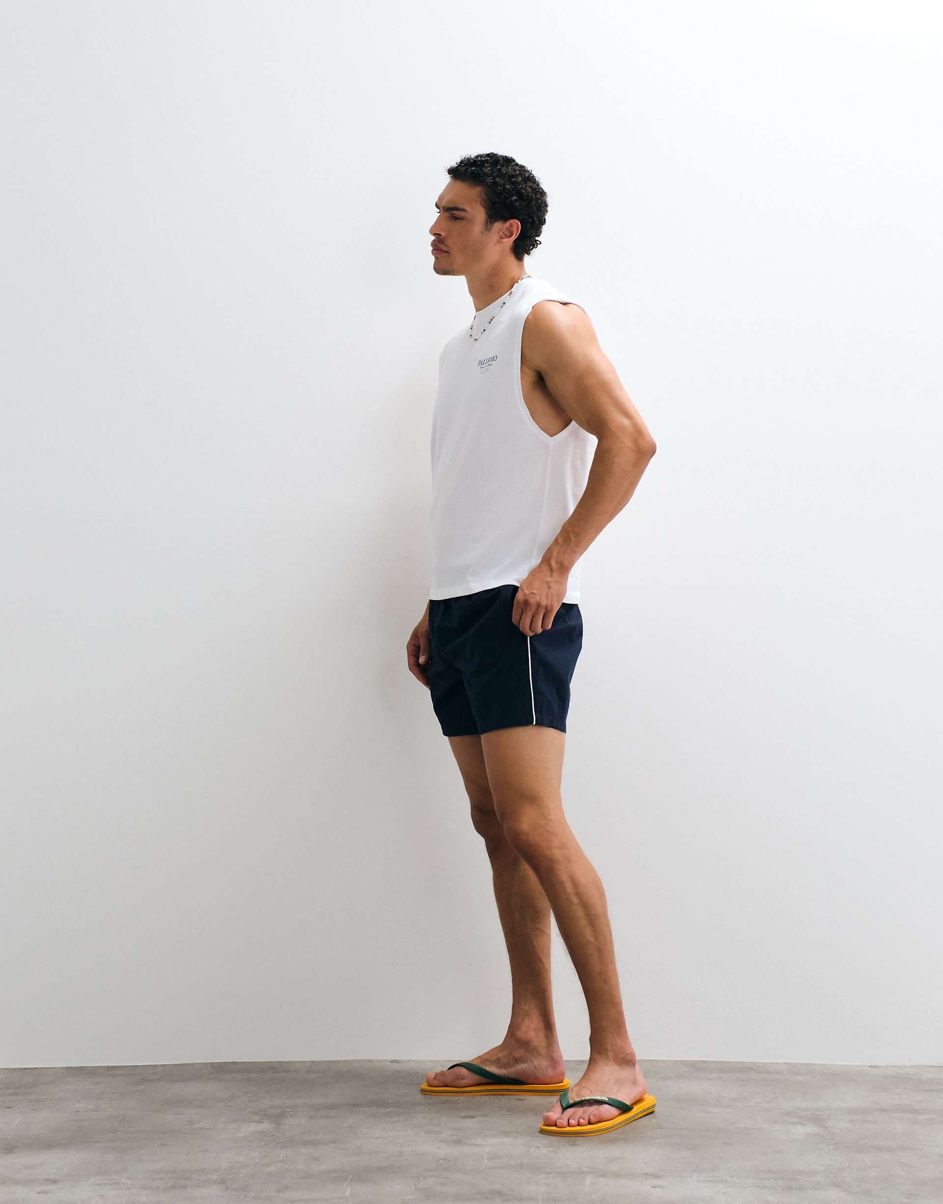 ASOS DESIGN wide leg mid length elasticized nylon shorts with piping in navy