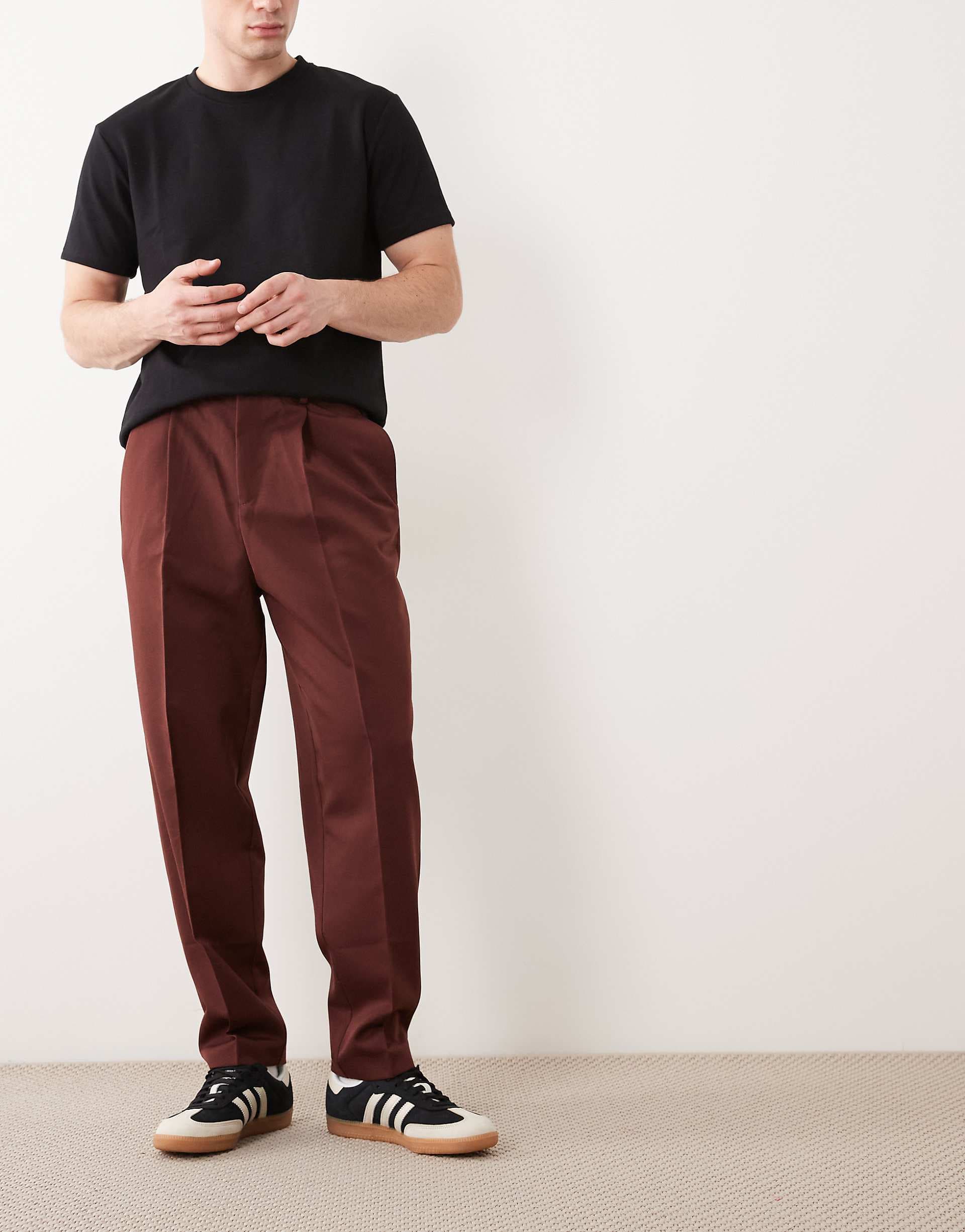 ASOS DESIGN tailored pleated relaxed tapered pants in burgundy