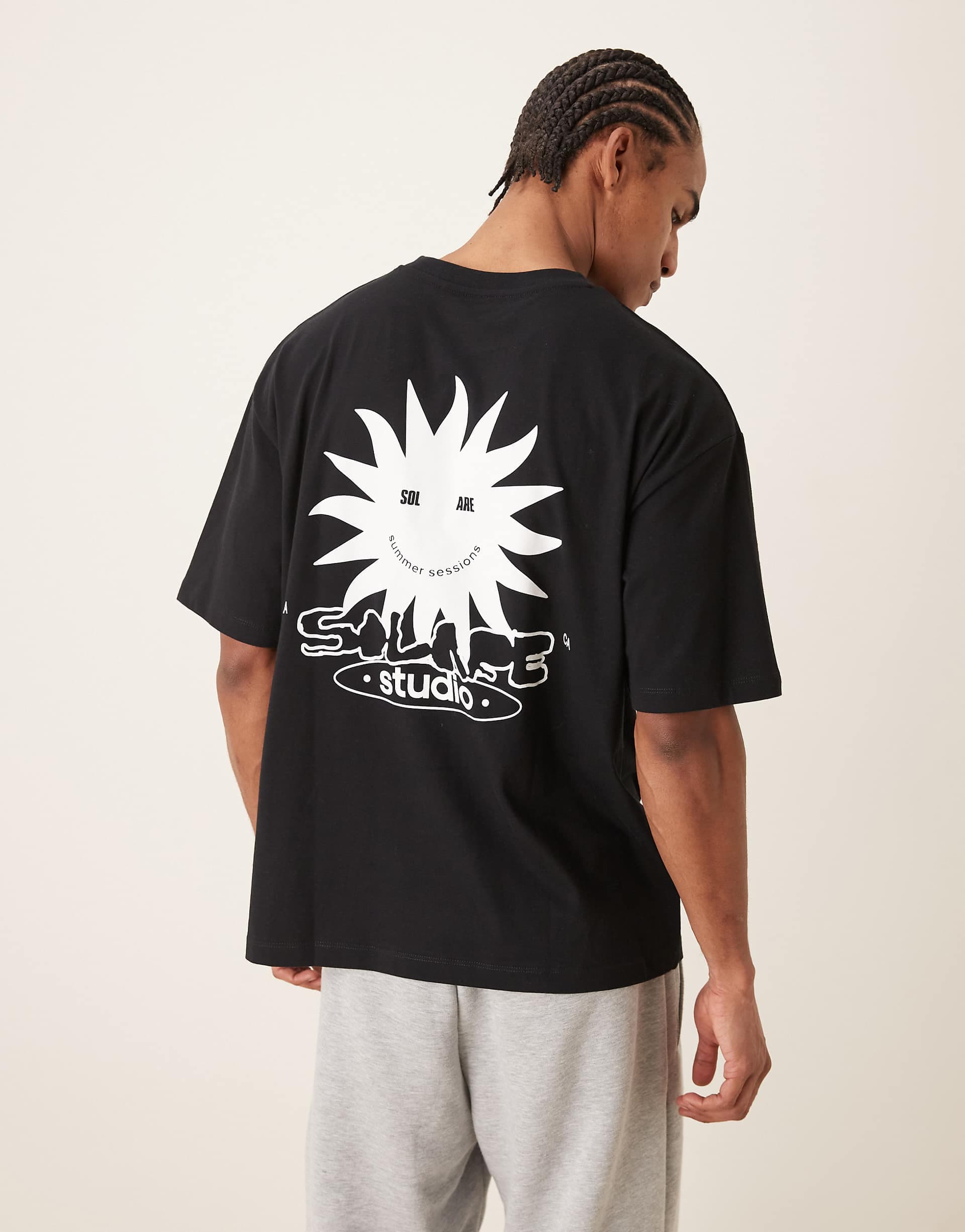 ASOS DESIGN oversized T-shirt with Solare Studio graphic in black