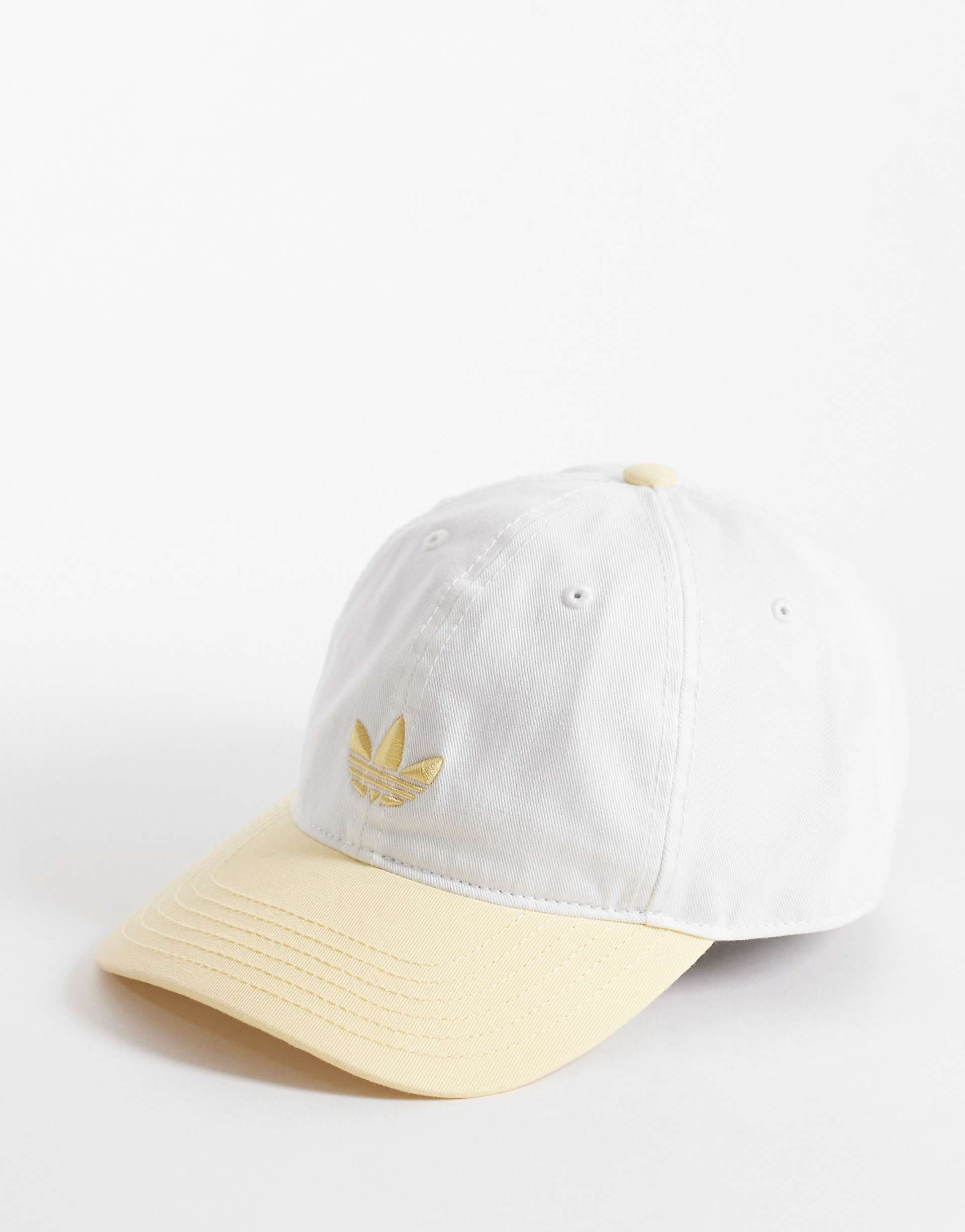 adidas Originals Relaxed strapback cap in white and yellow