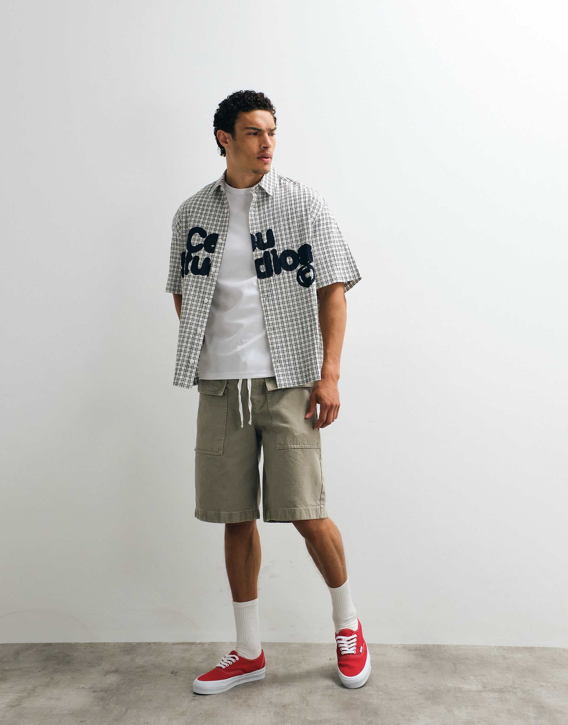 ASOS DESIGN boxy oversized plaid shirt with chest print in black and white