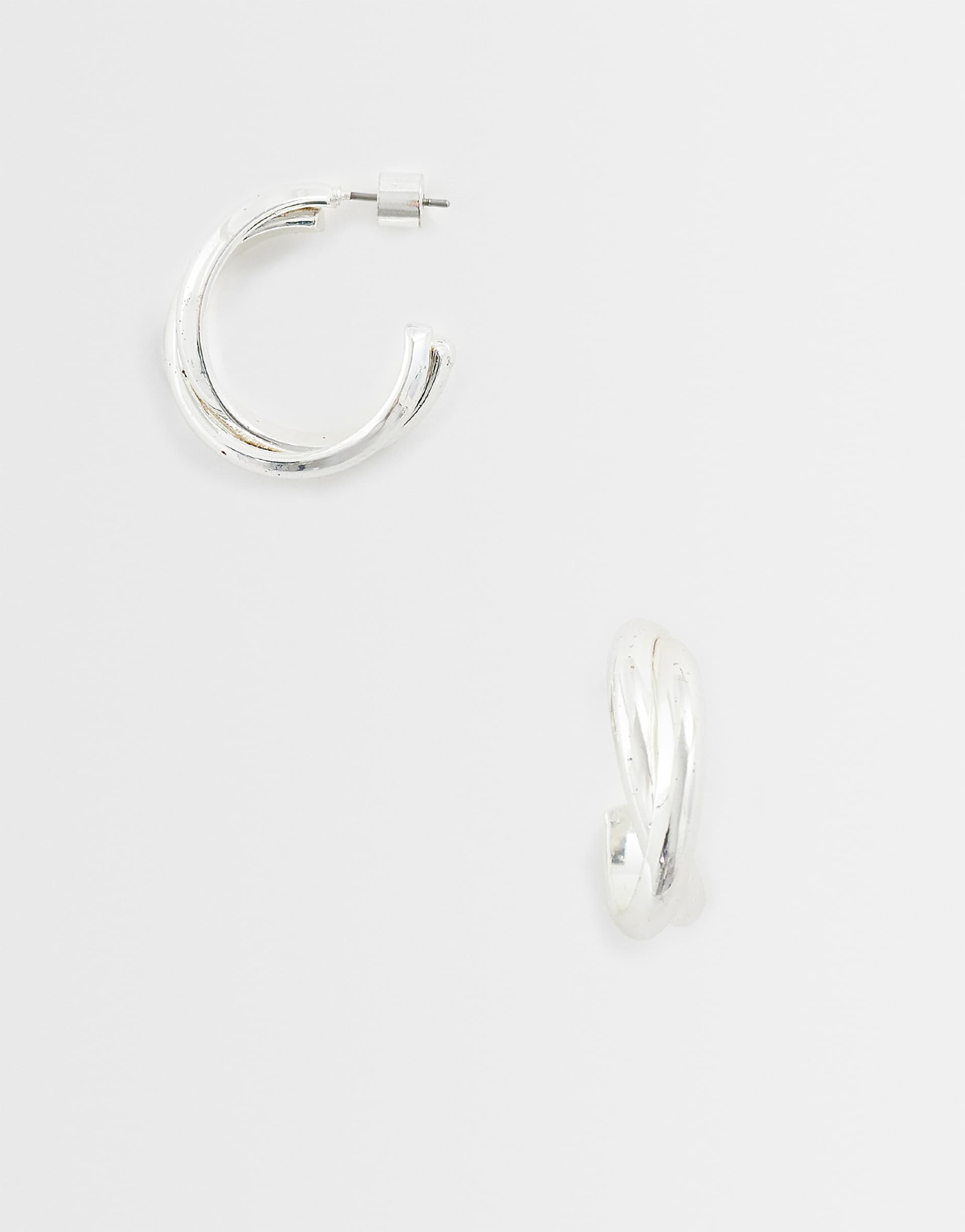 Mango cross over stud earring in silver