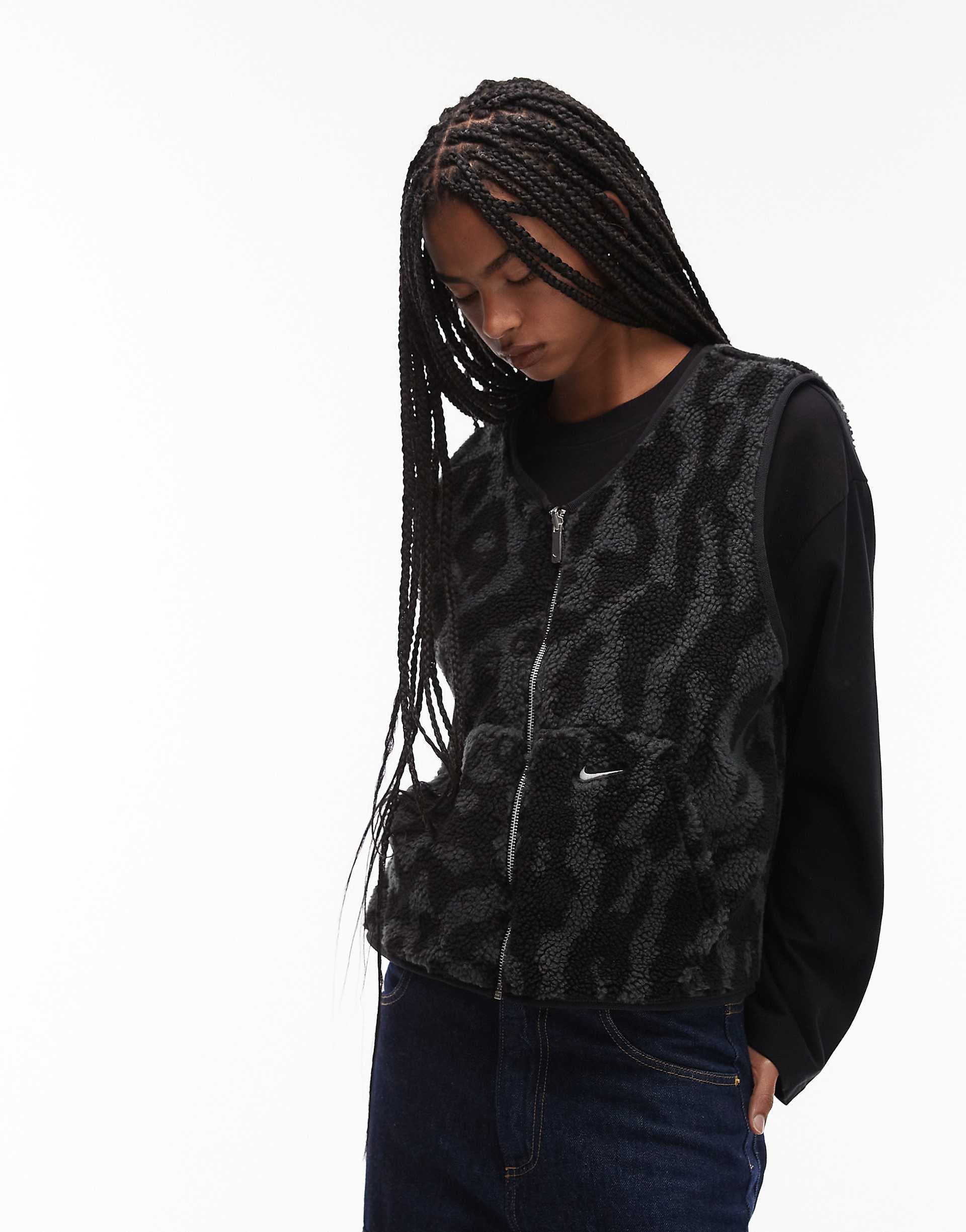 Nike Street reversible sherpa vest in black and leopard print