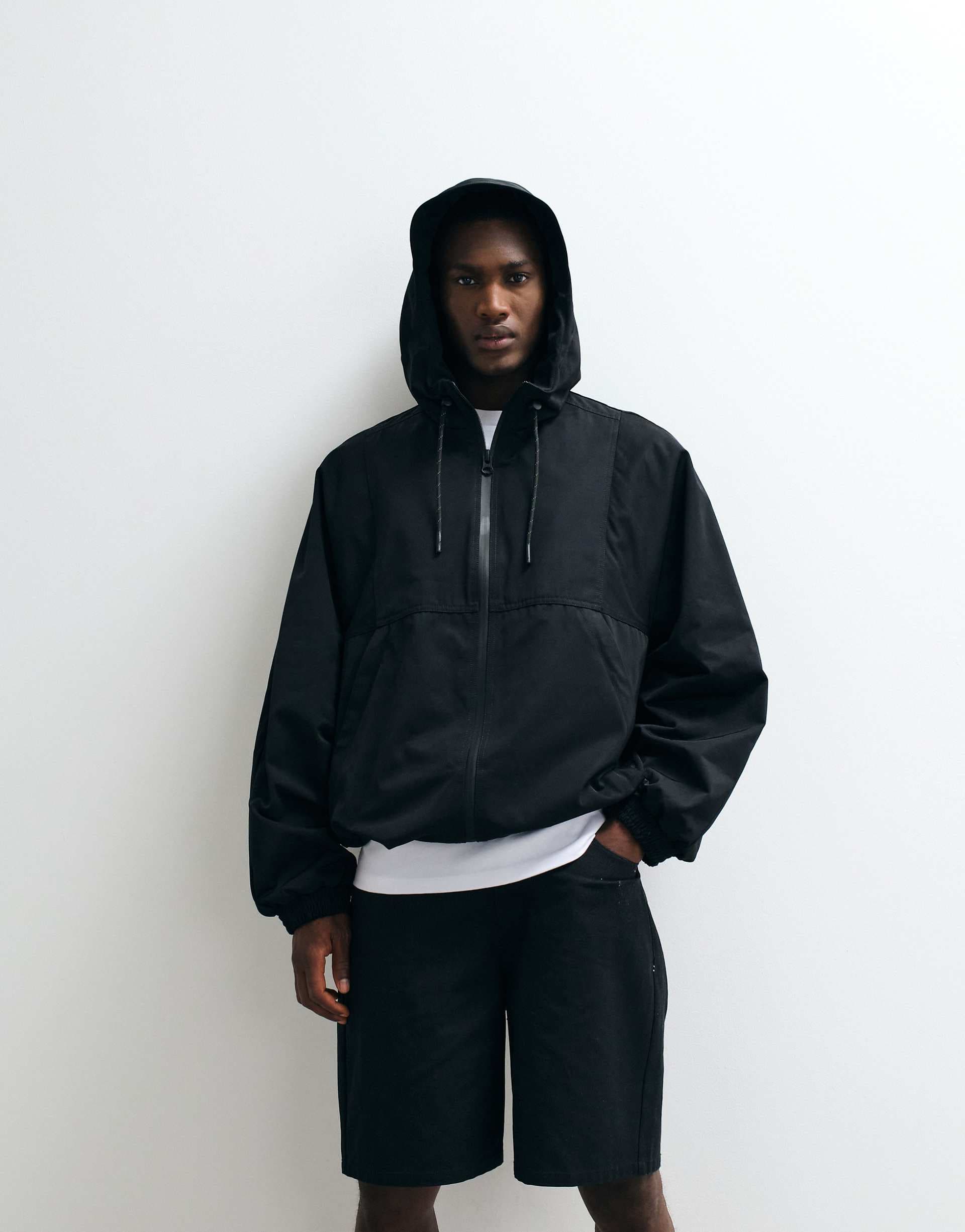 ASOS DESIGN stormMAX™ water repellent hooded track jacket in black