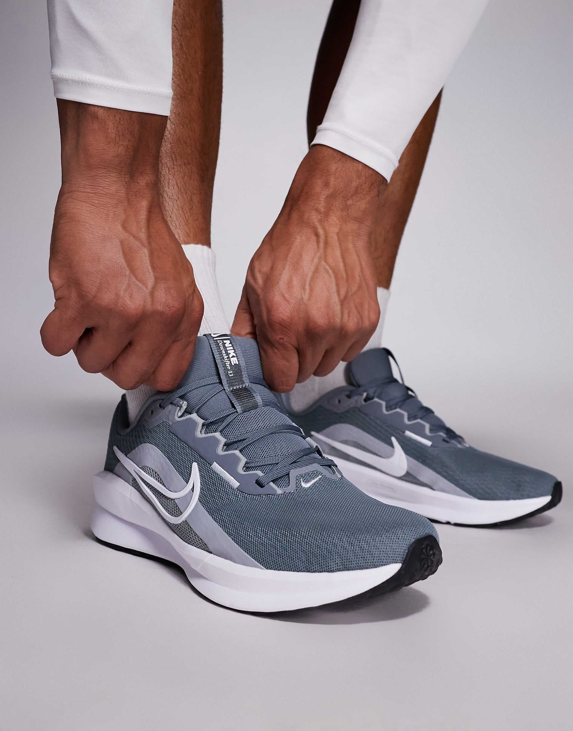 Nike Downshifter 13 running sneakers in gray and white