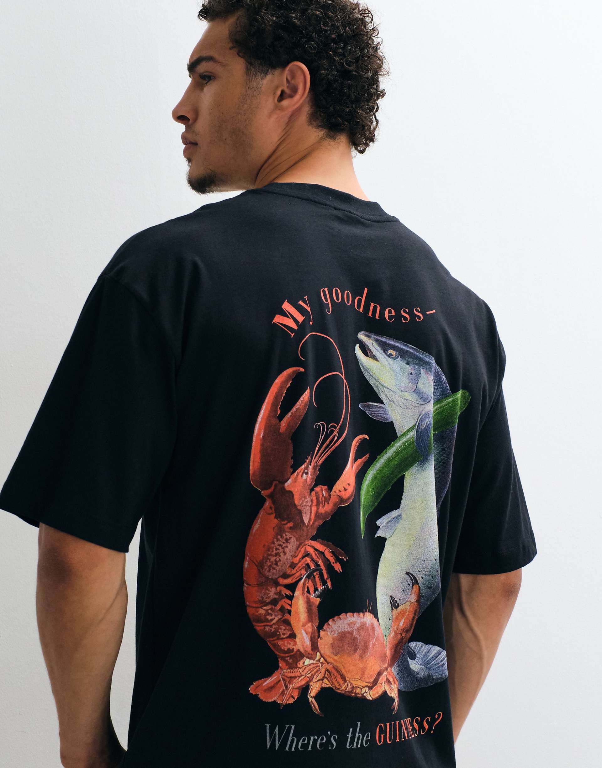 ASOS DESIGN oversized tee with Guinness print in Black