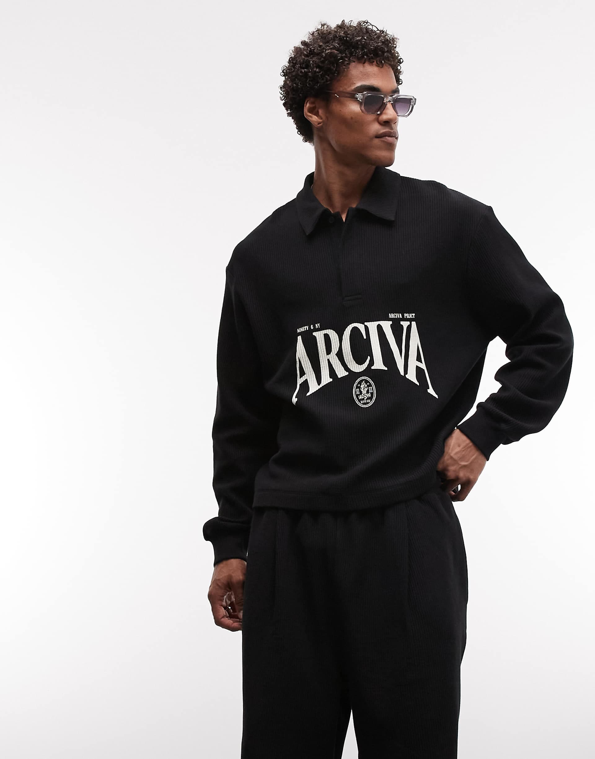ASOS DESIGN relaxed boxy ottoman textured polo shirt with text graphic in black