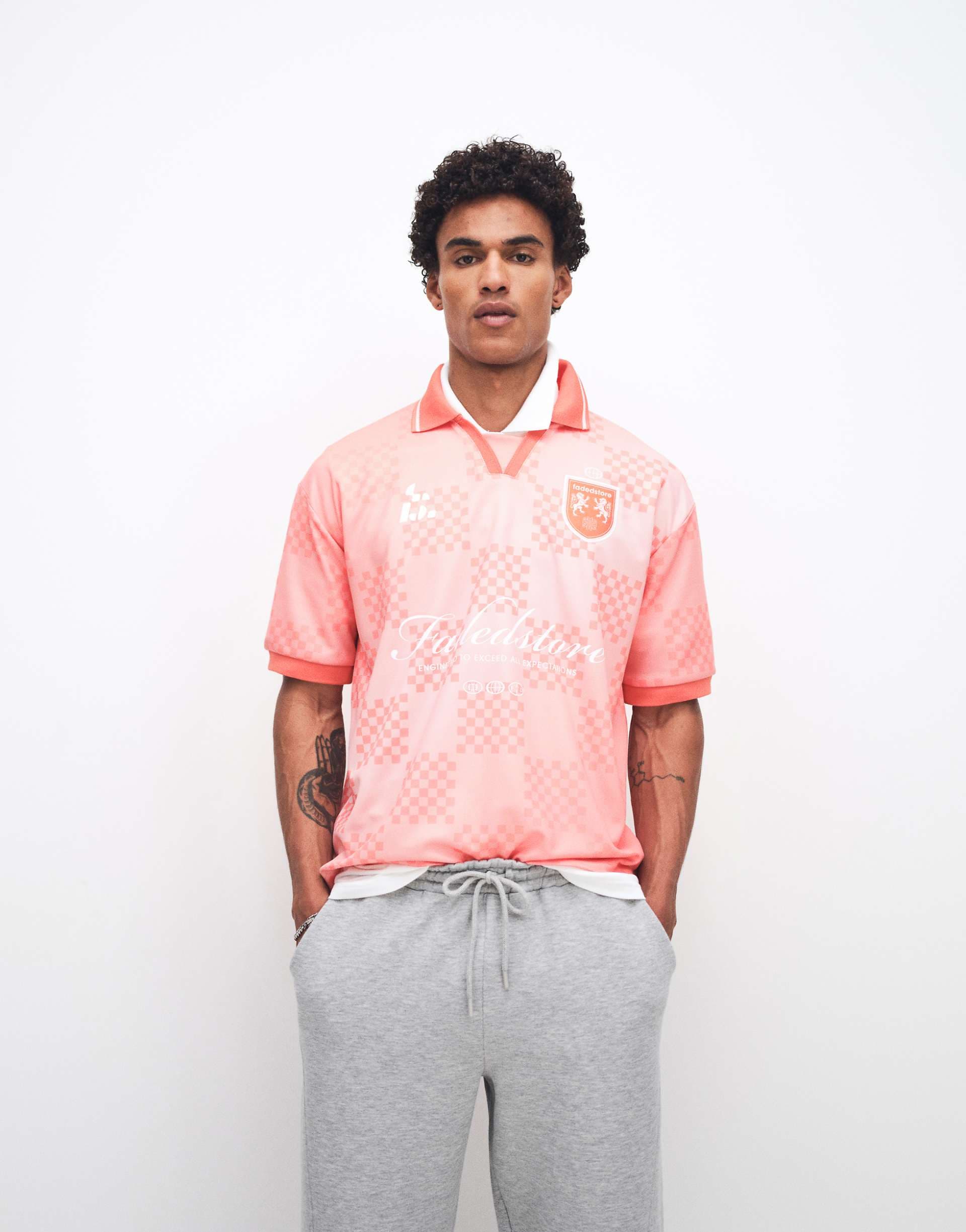Faded Store logo soccer jersey with contrast collar in coral