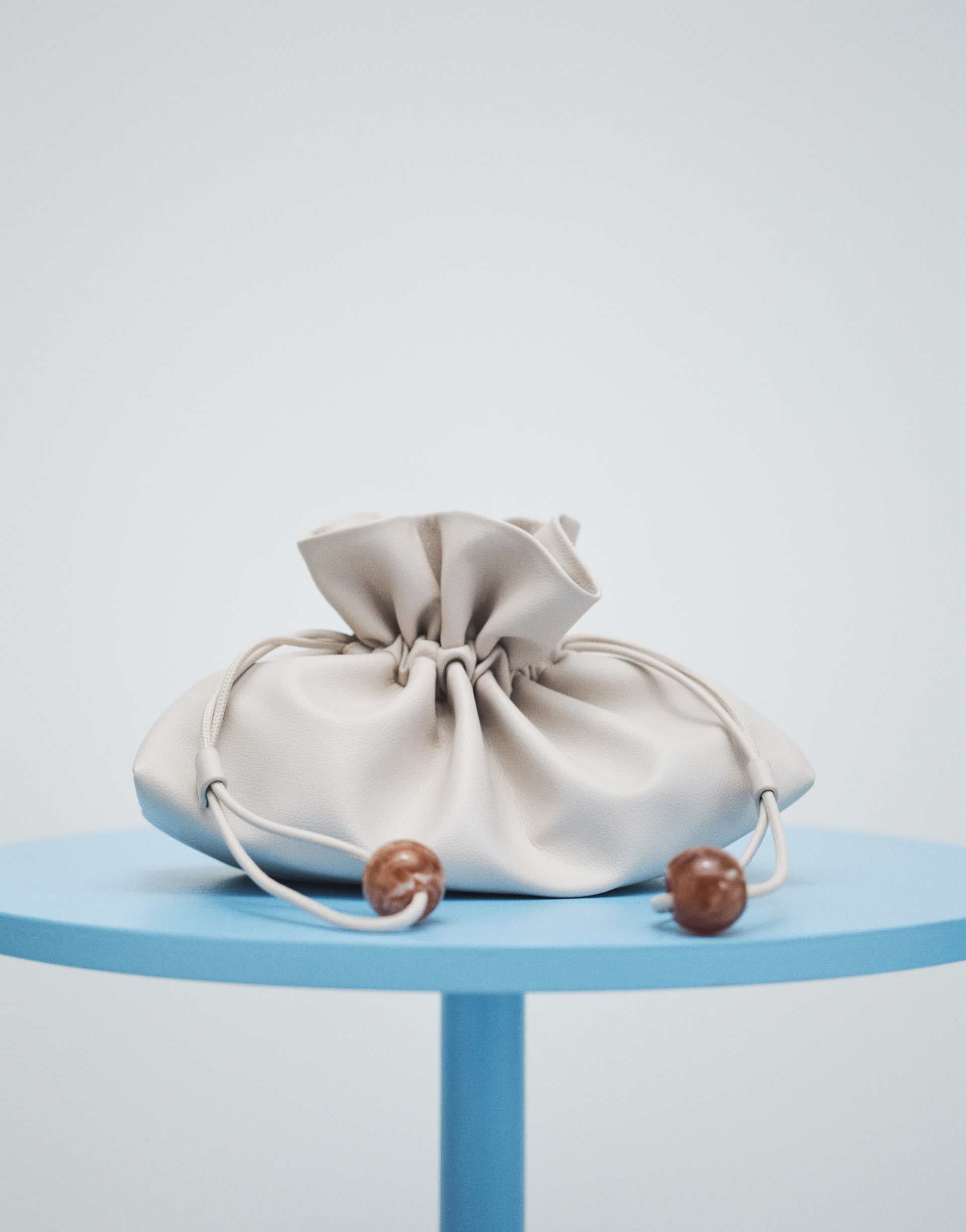 ASOS DESIGN ruched resin ball pouch clutch bag with detachable shoulder strap in stone