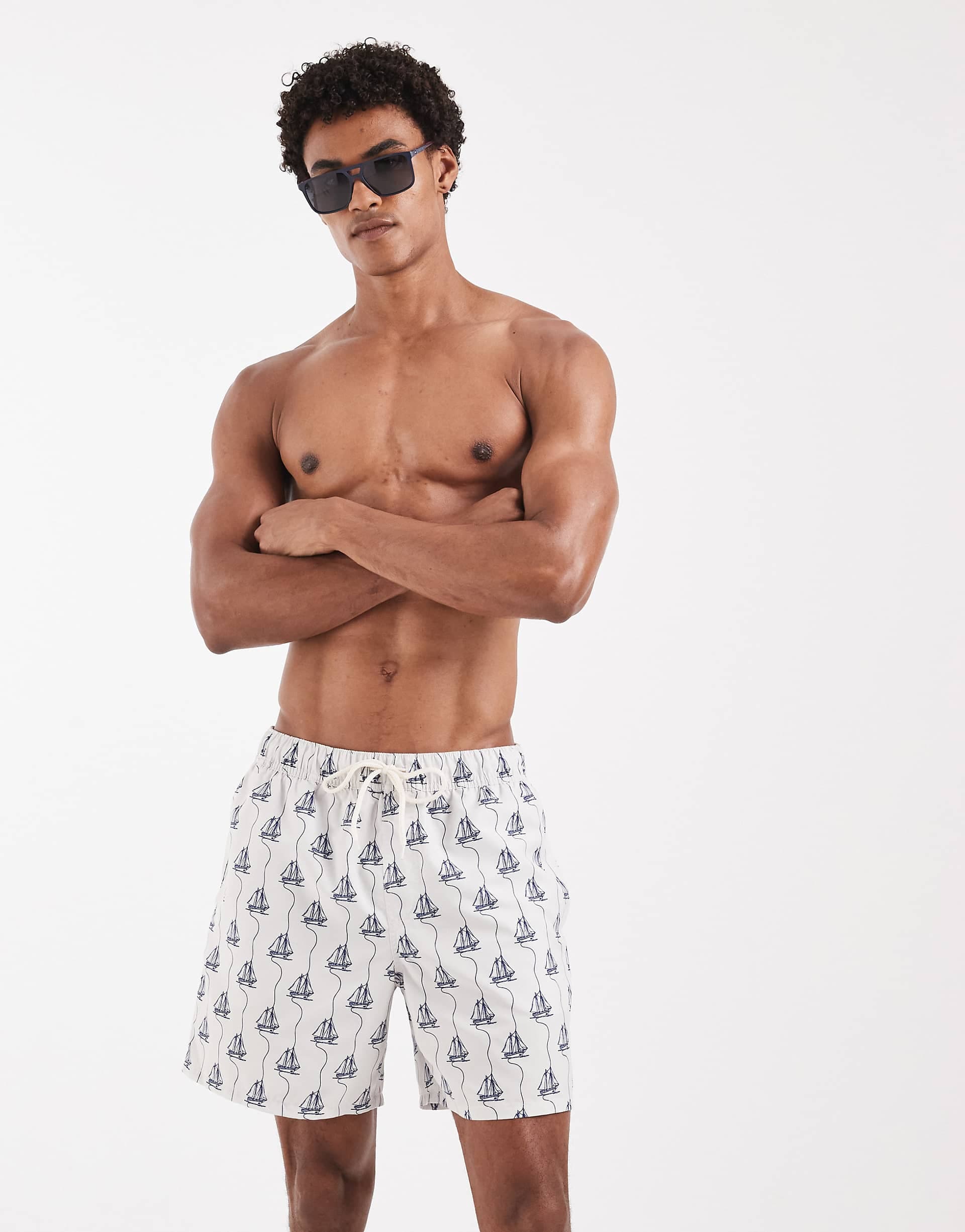 ASOS DESIGN swim shorts in mid length with boat print in cream