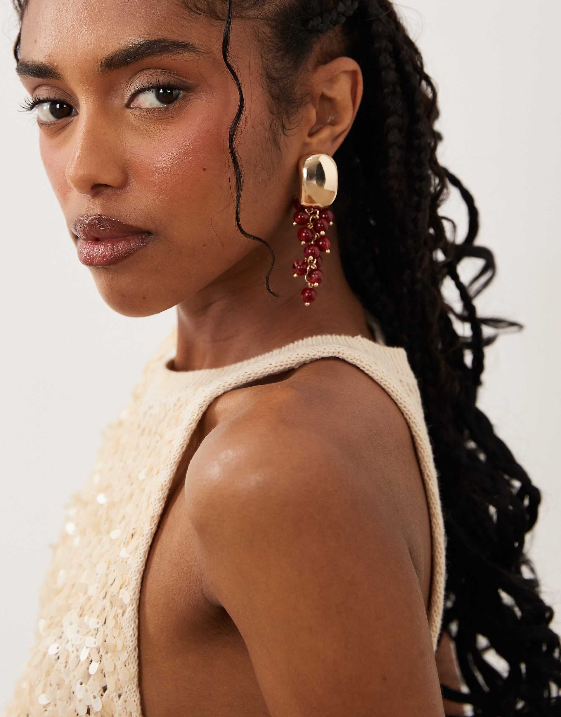 ASOS DESIGN stud earrings with burgundy beads in gold tone