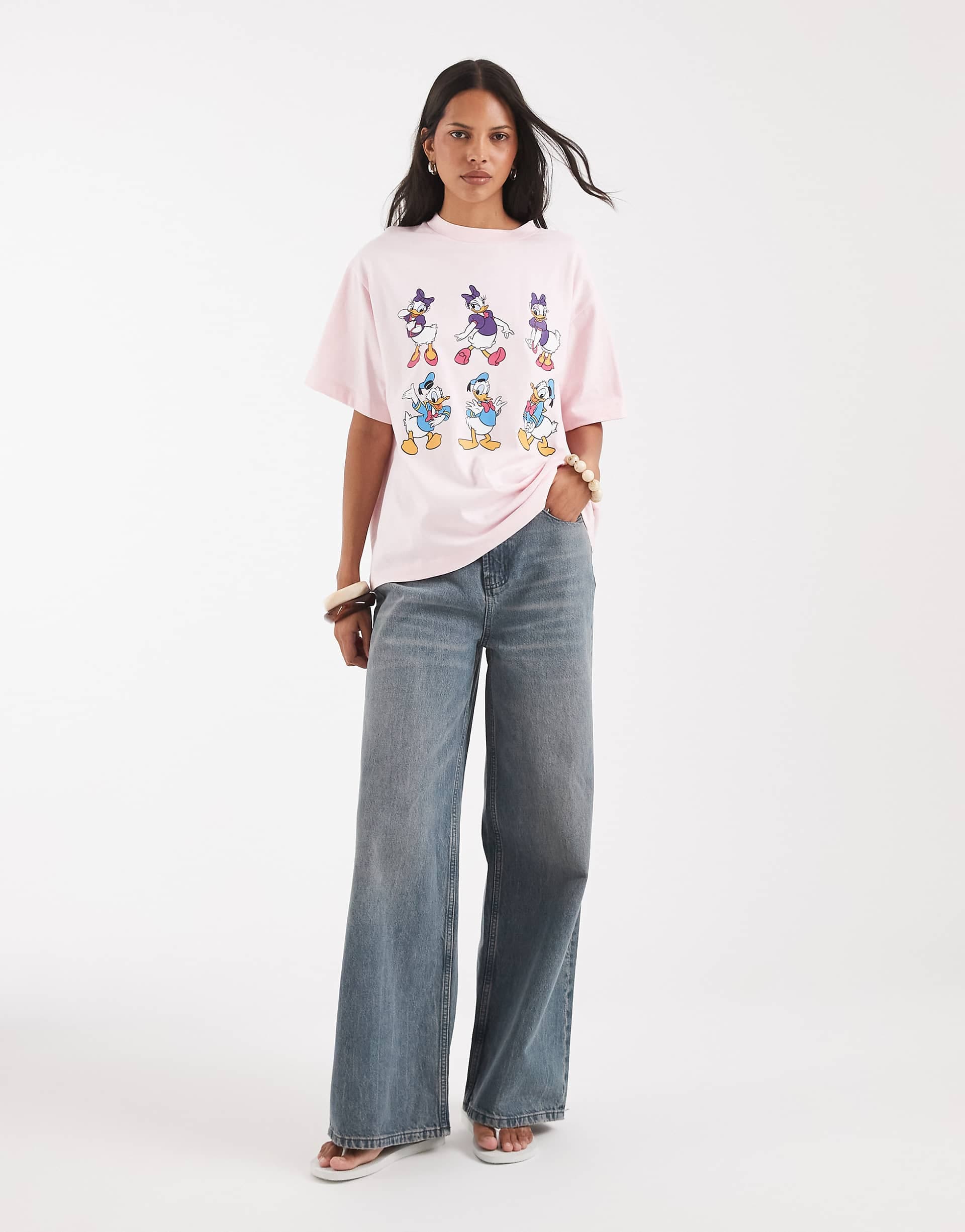 ASOS DESIGN Disney oversized T-shirt with Daisy & Donald duck print in pink