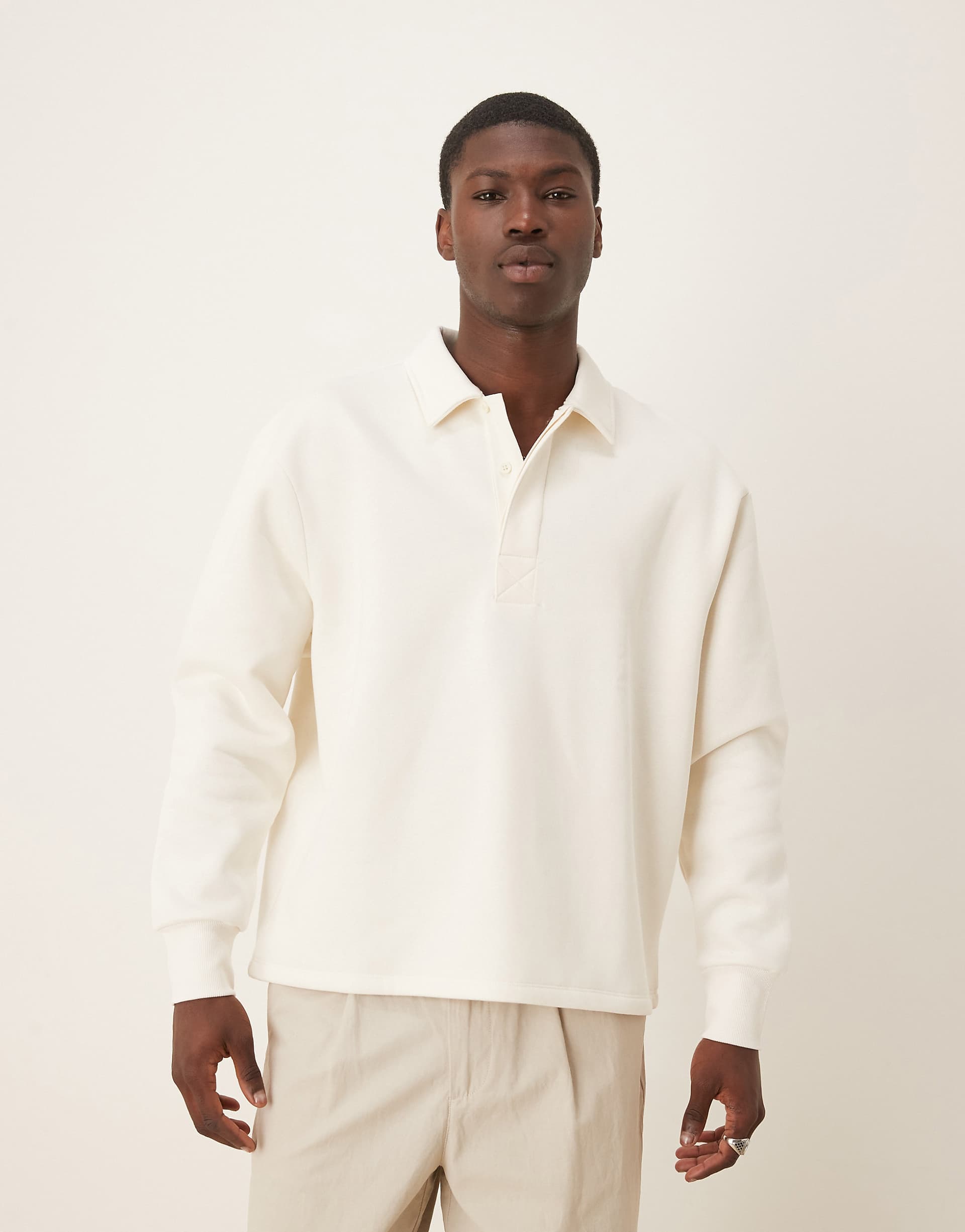 ASOS DESIGN relaxed button up polo sweatshirt with concealed placet in cream
