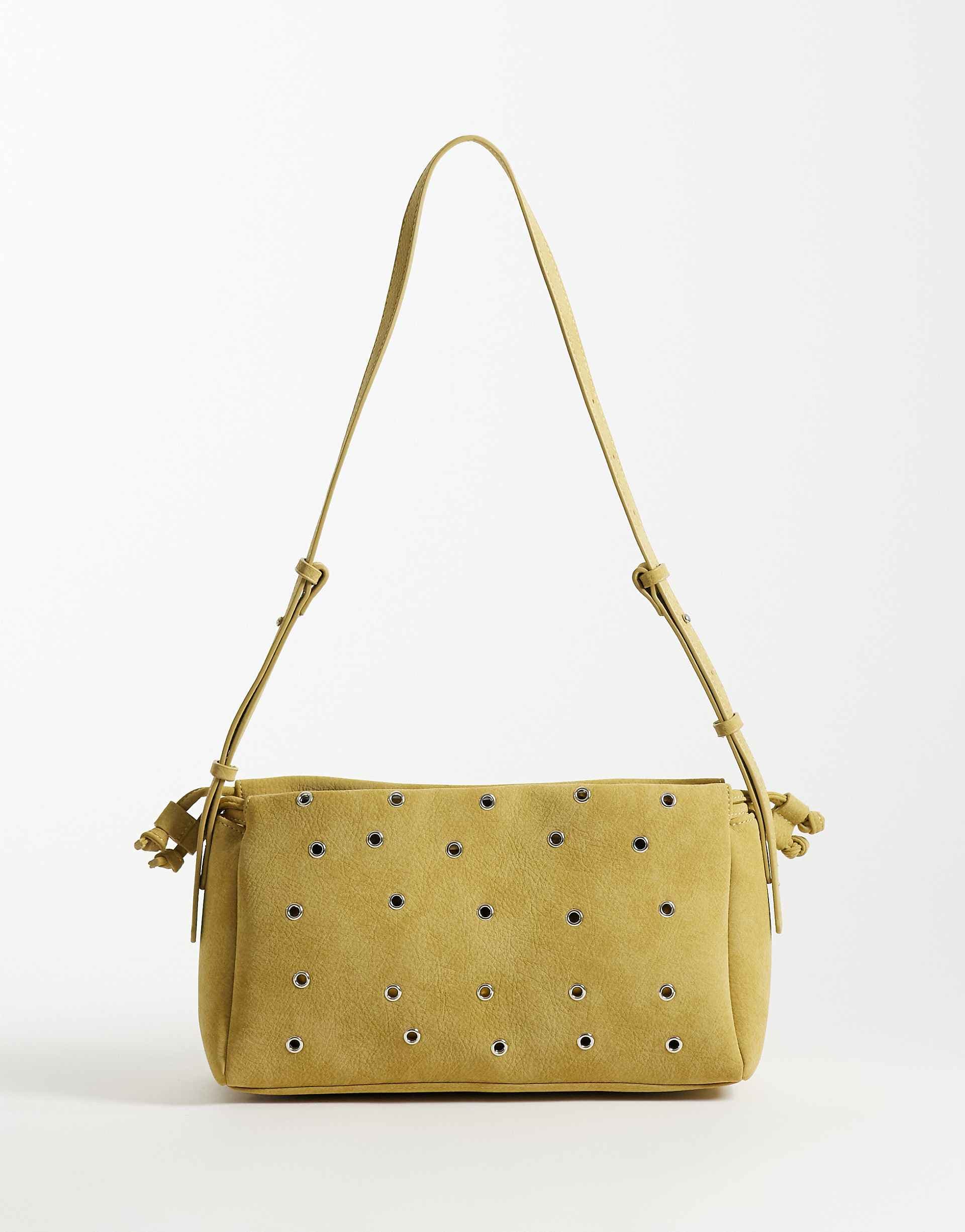 ASOS DESIGN grommet faux suede adjustable crossbody bag in ocher